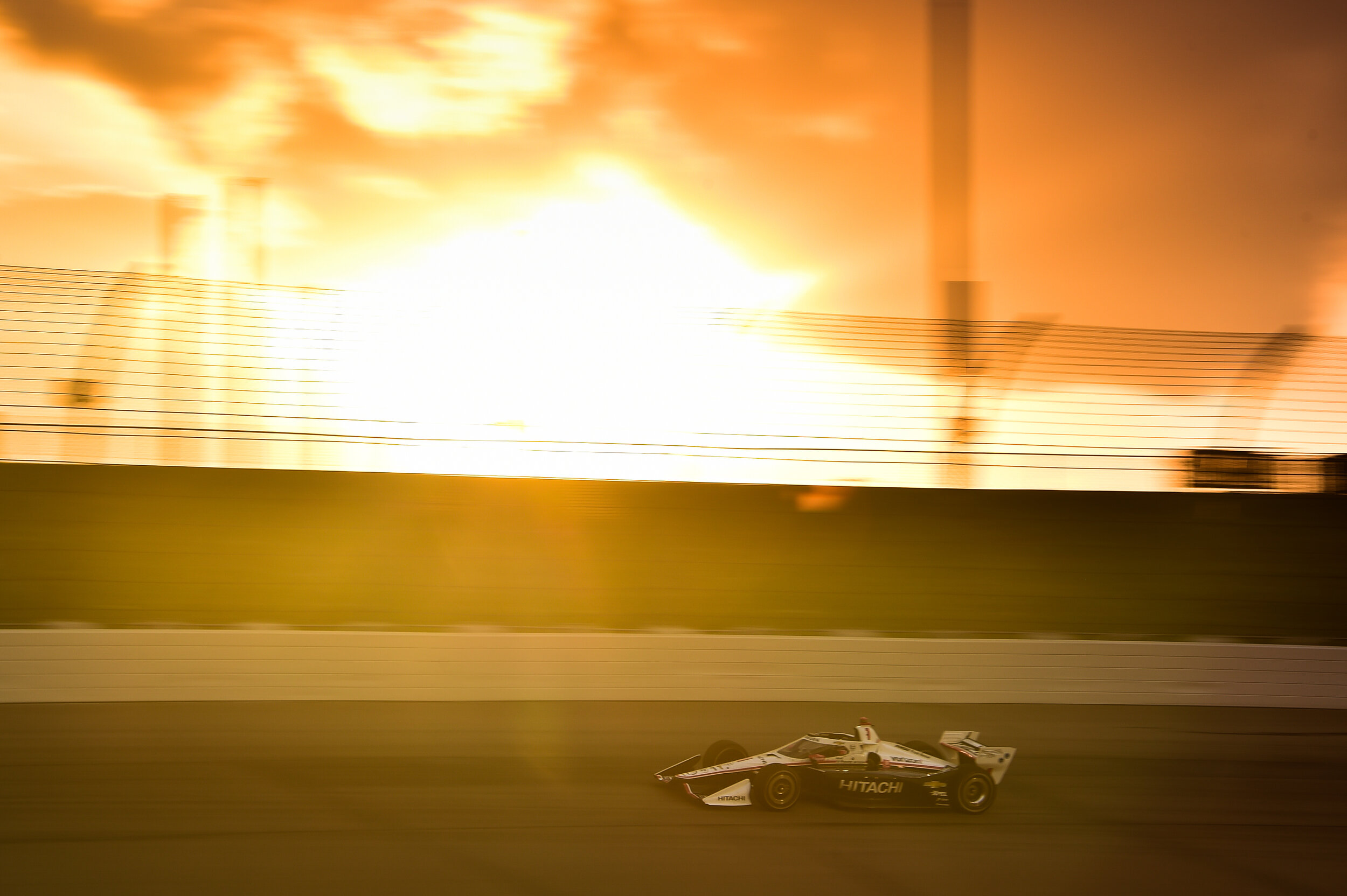  Josef Newgarden races through the beautiful sunset at Iowa Speedway. 