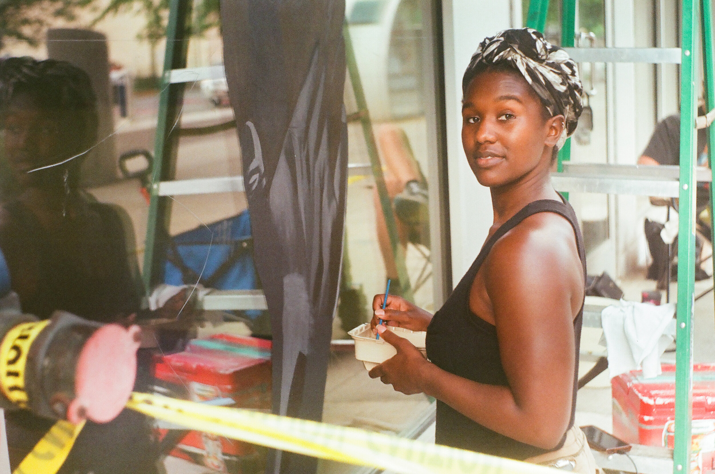  Amiah painting her BLM mural - Washington St, Indianapolis, IN. 