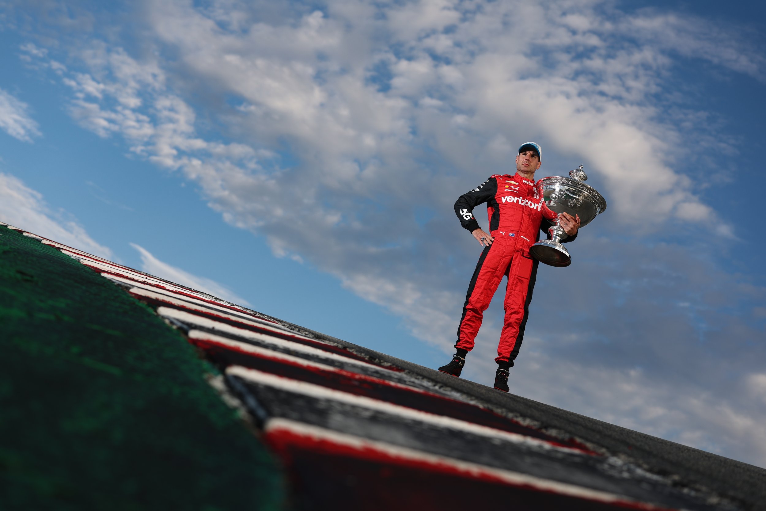 Will Power holds the Astor Cup after winning the 2022 IndyCar Championship. 