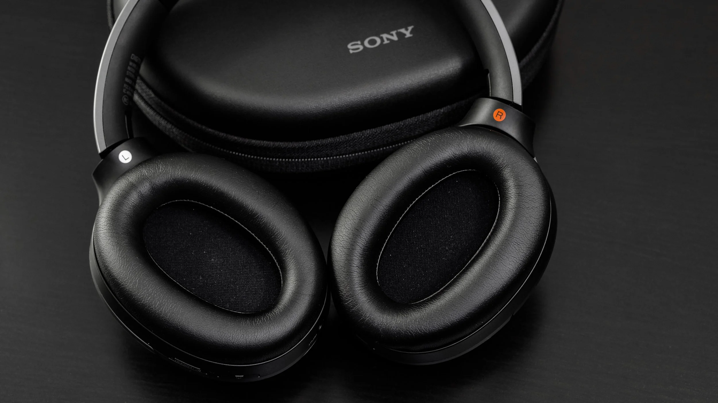 Narrow, shallow ear cups and a layer of mesh that likes to get fresh with your ears make for a warm environment.