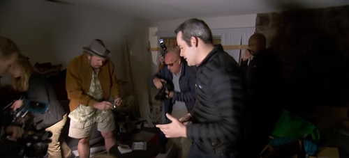 Reporters swarm inside the shooter's home