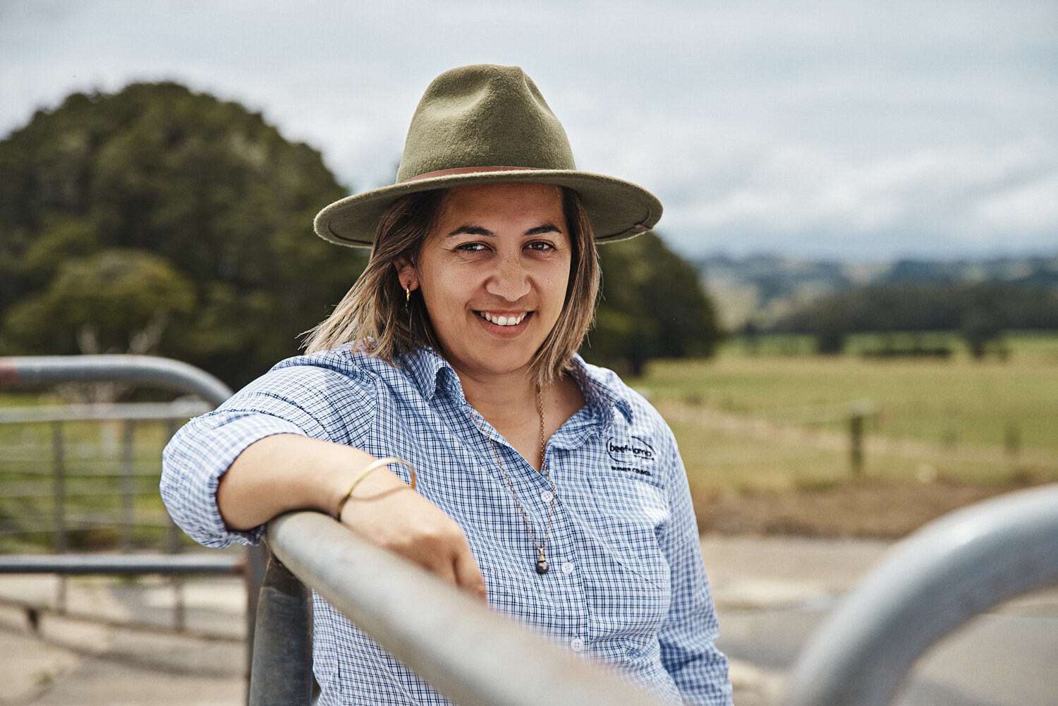 IVDM_Northland female farmer leaning on fence.jpg