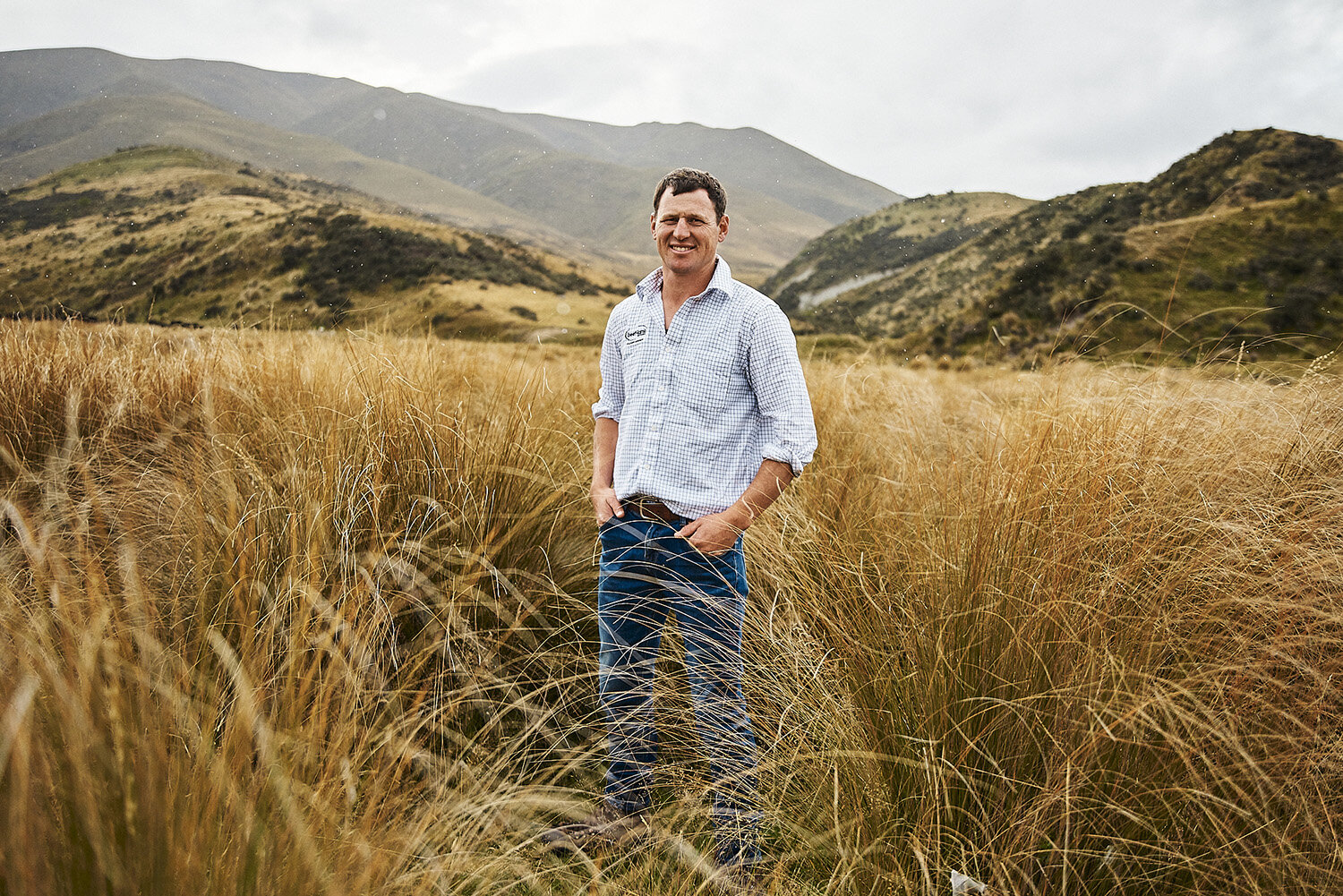 IVDM Photography_South Island farmer standing in t.jpg