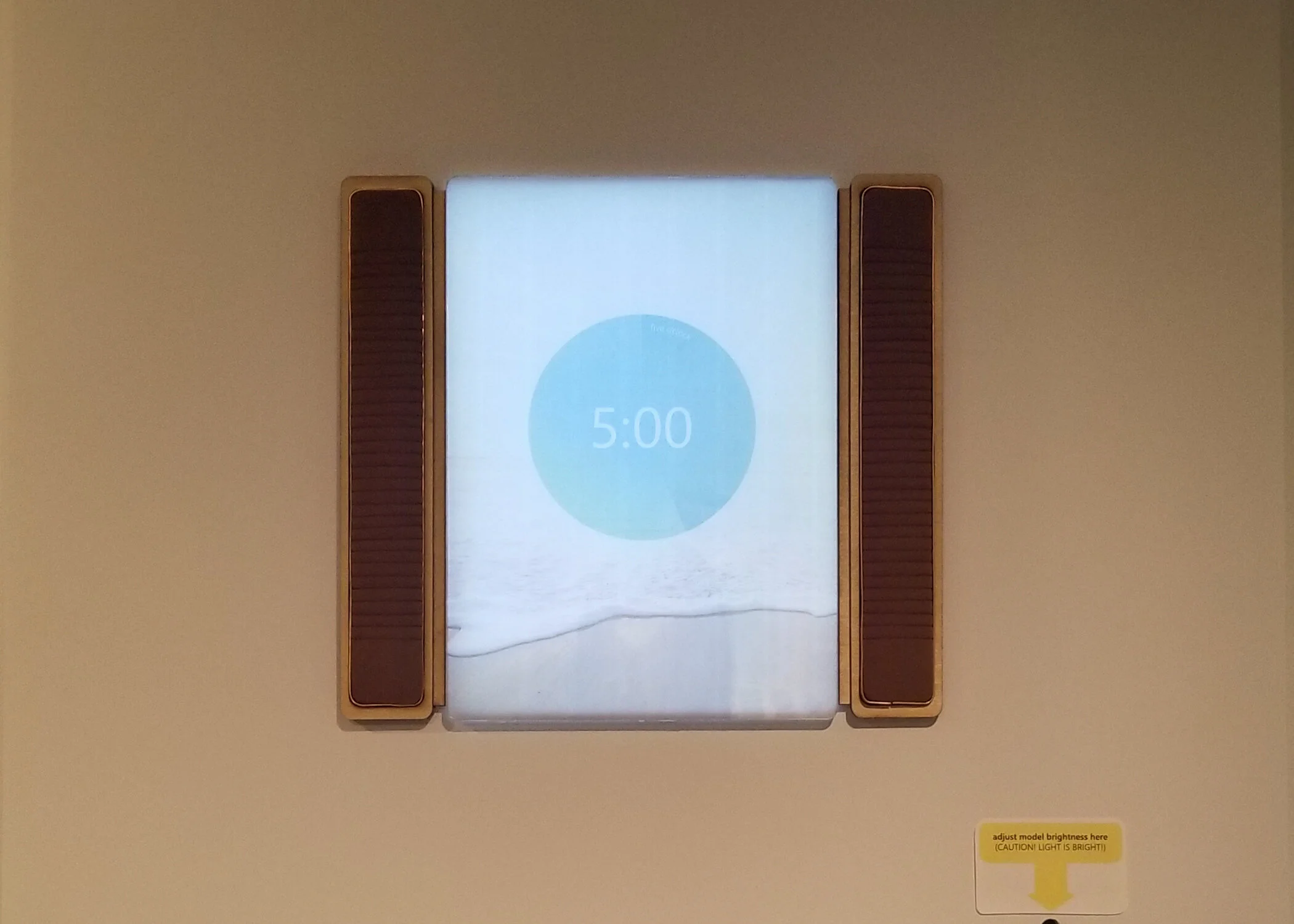 Circadian Window Prototype built with a 10,000 LUX Dimmable Therapy Lamp, lasercut acrylic glass, vellum print, lasercut plywood, flat copper wire, and re-purposed fabric for the speakers.