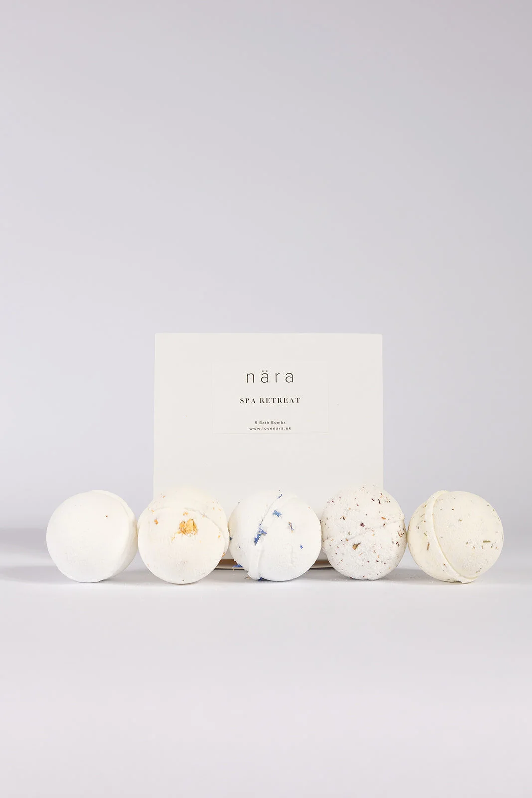 Spa Retreat gift box with five bath bombs lined up in front to show different scents