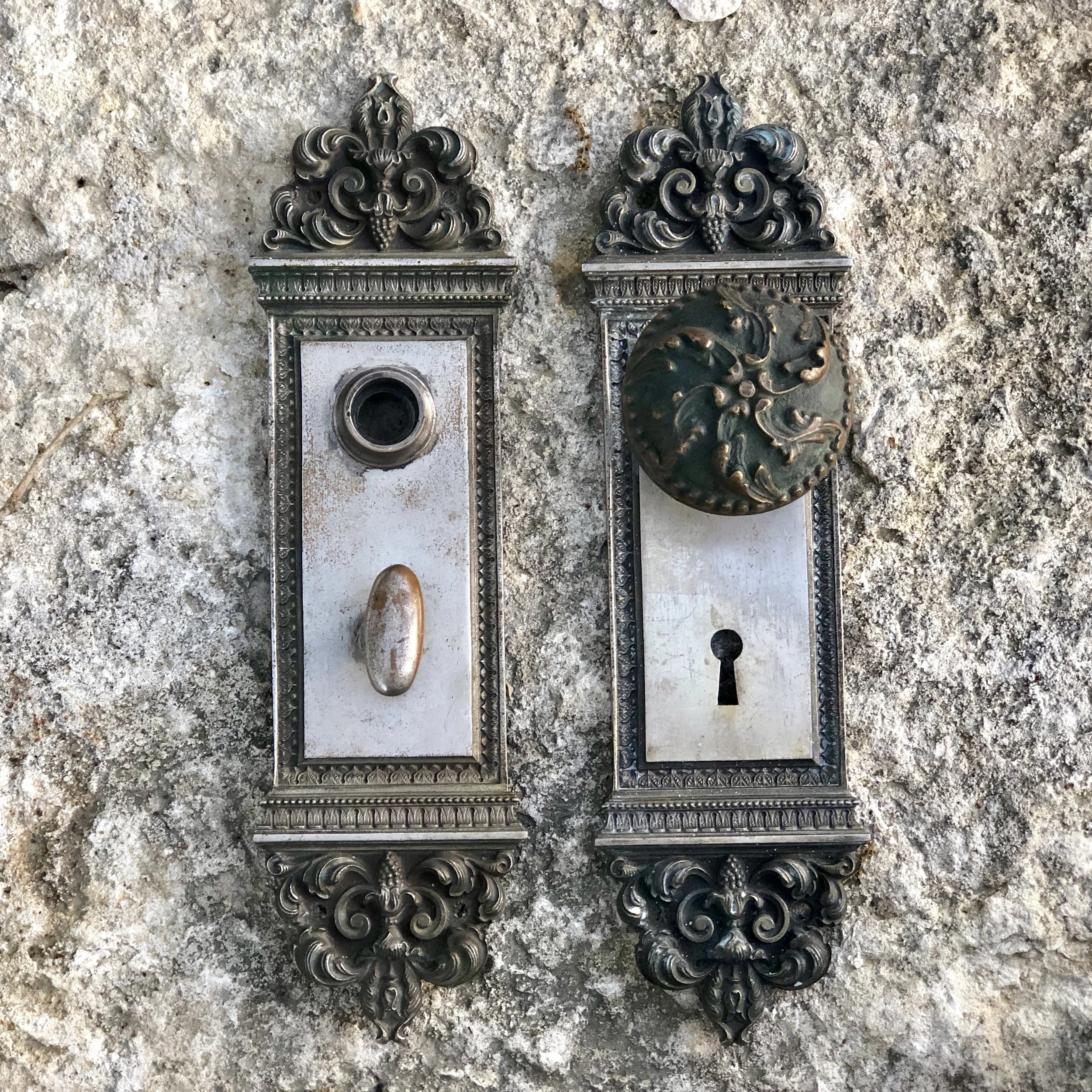 Antique door plates and a knob from the Victorian era. 