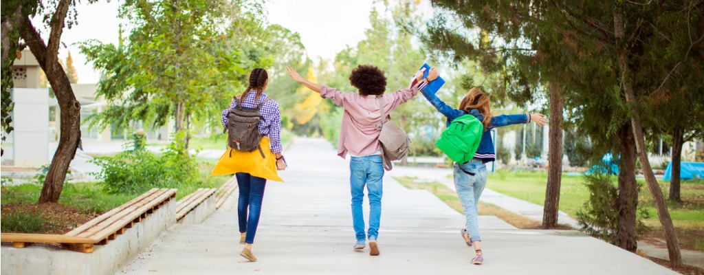 happy-students-with-arms-raised-on-air-picture-id849234490.jpg