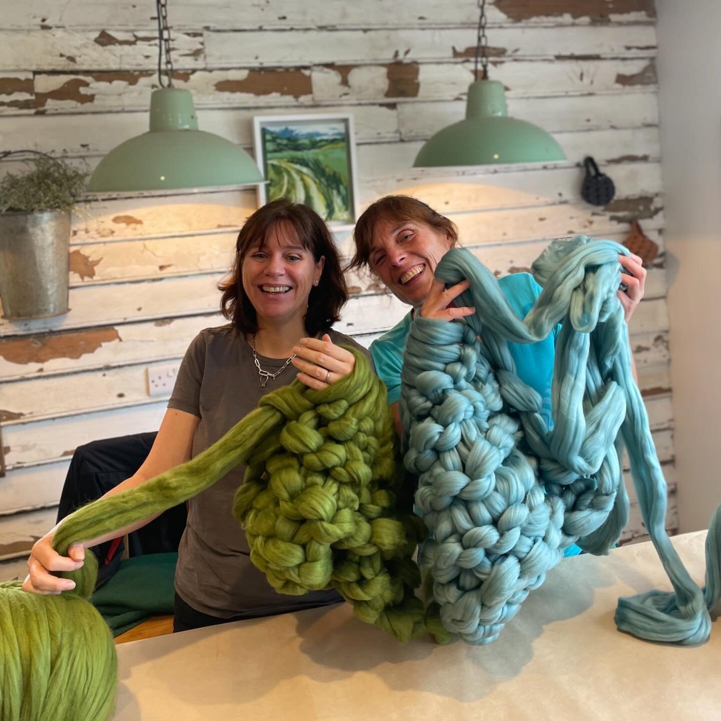 I love this joyful image of Aly &amp; Anne ARM KNITTING @pitfieldbarnflowers ! 

This is our most popular workshop, everyone can quickly learn the skills to create these cosy blankets &amp; using their arms as needles ! 

Did you know, we also have k