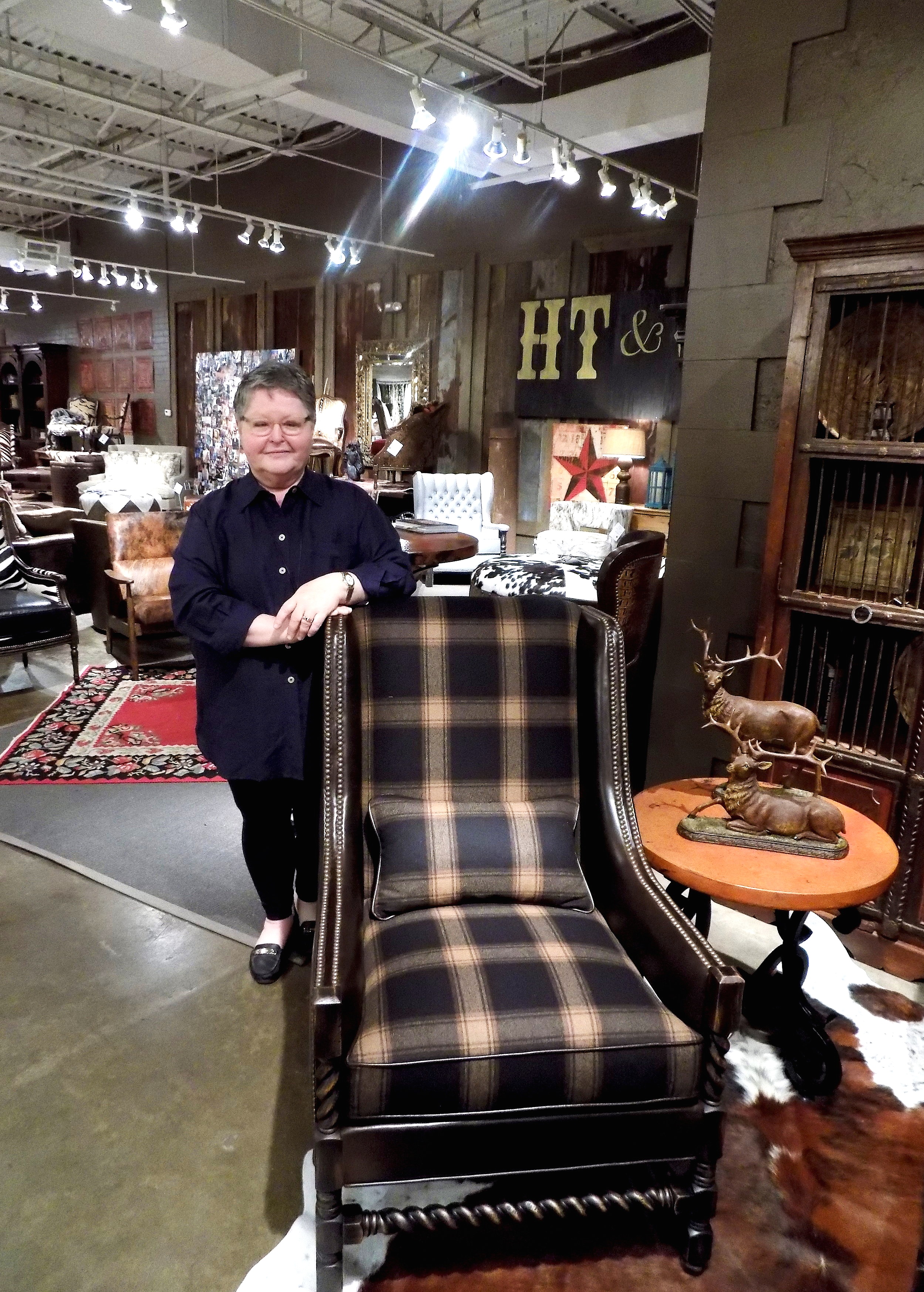 Ronna Griest, Design Director for Paul Robert Furniture, with Scottie, a modernized wing chair inspired by an English reproduction from the 1900s. Photo: The Design Daily