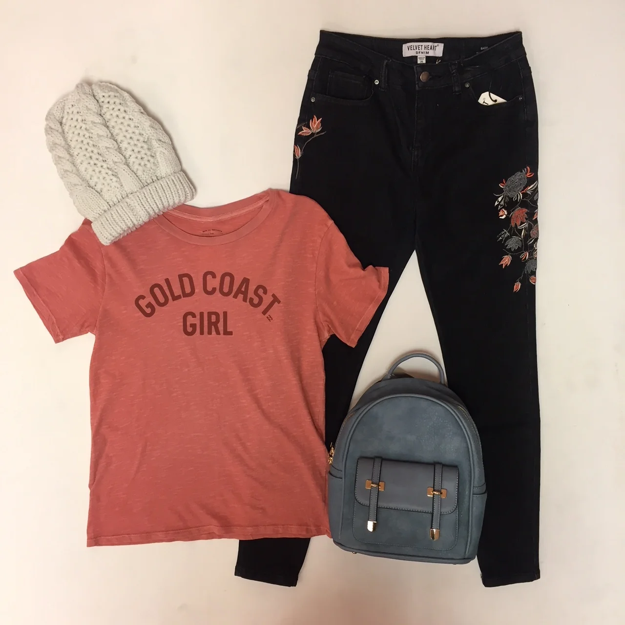 Embroidered Jeans $79, "Gold Coast Girl" Tee $29.95, Backpack $49, Hat $16