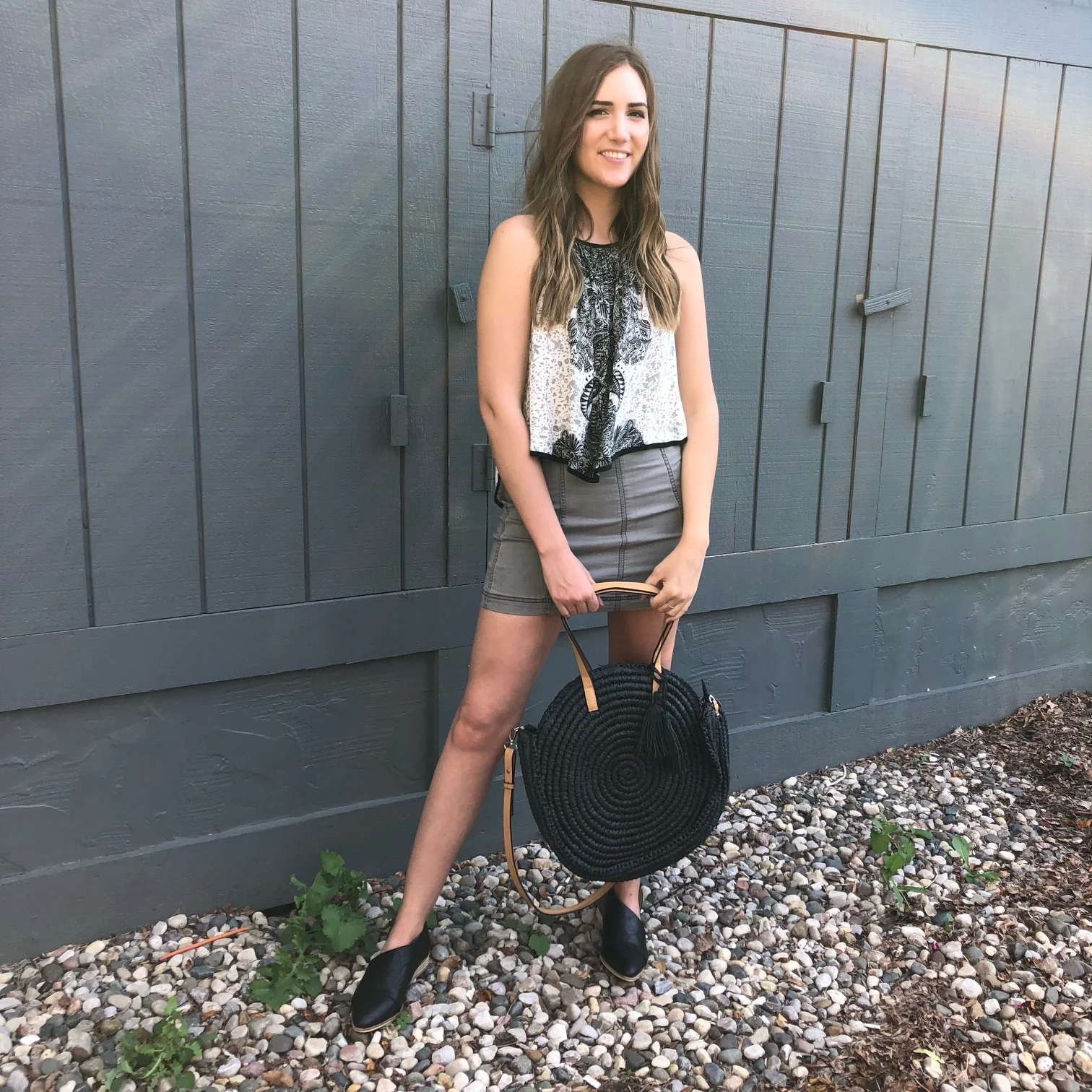 Free People Black and White Tank Top $68, Free People Modern Femme Mini $50, Straw Purse $42, Black Sidecut Loafers $42