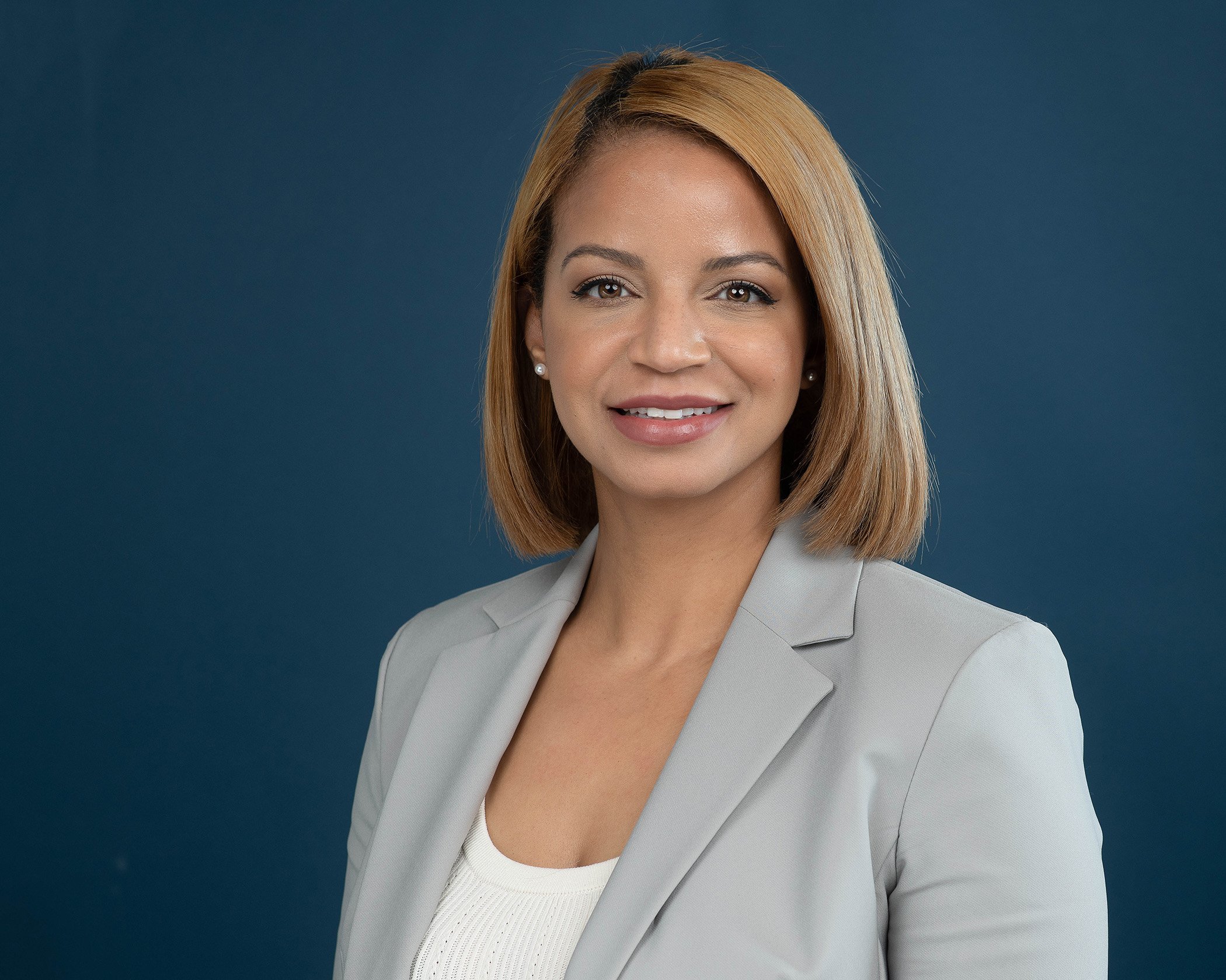 Courtney-Criddle-Photography-Company-Headshot-Photo-on-Blue-Backgrond.jpg