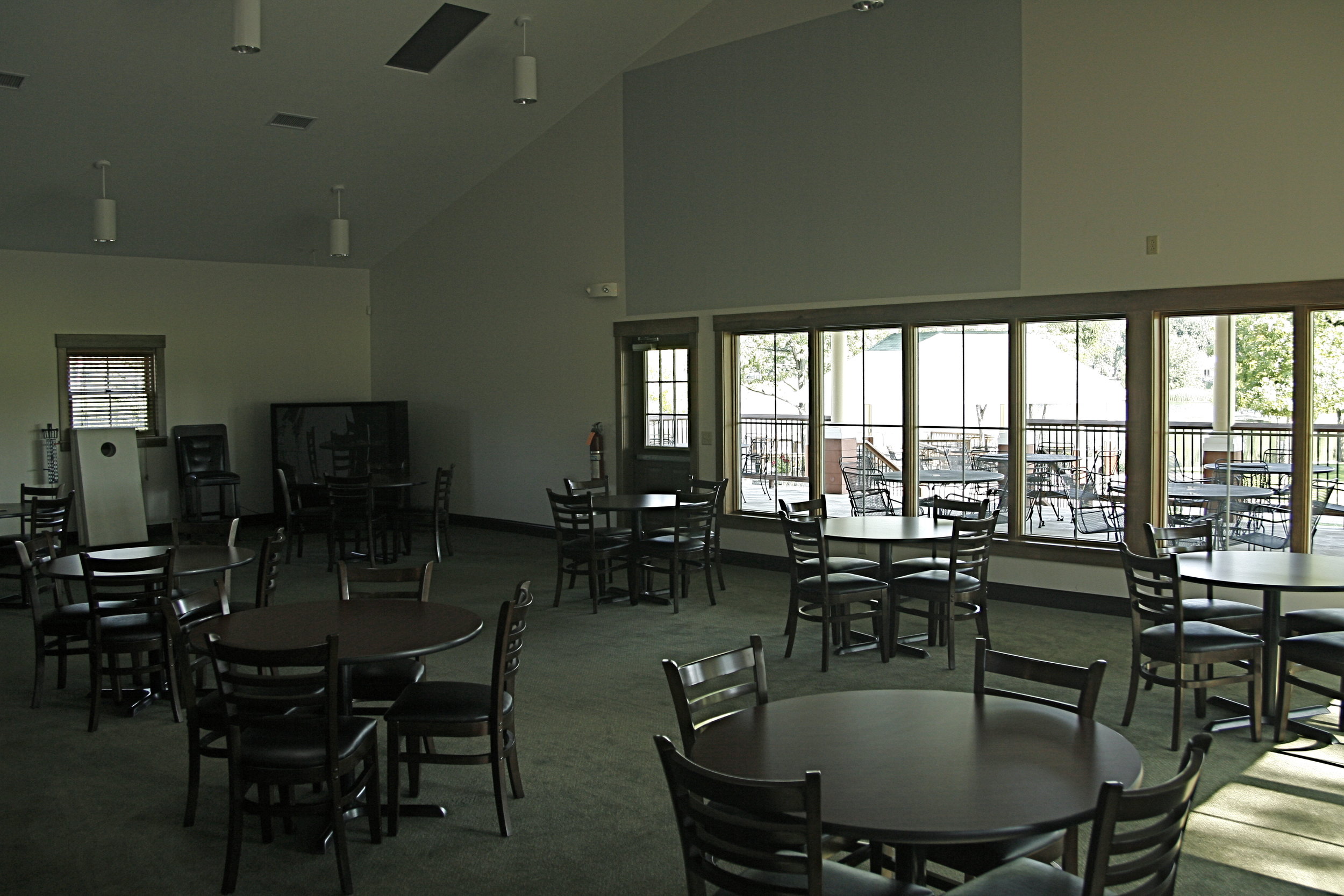 Seating located just beyond the bar inside the Frank Horvath Clubhouse