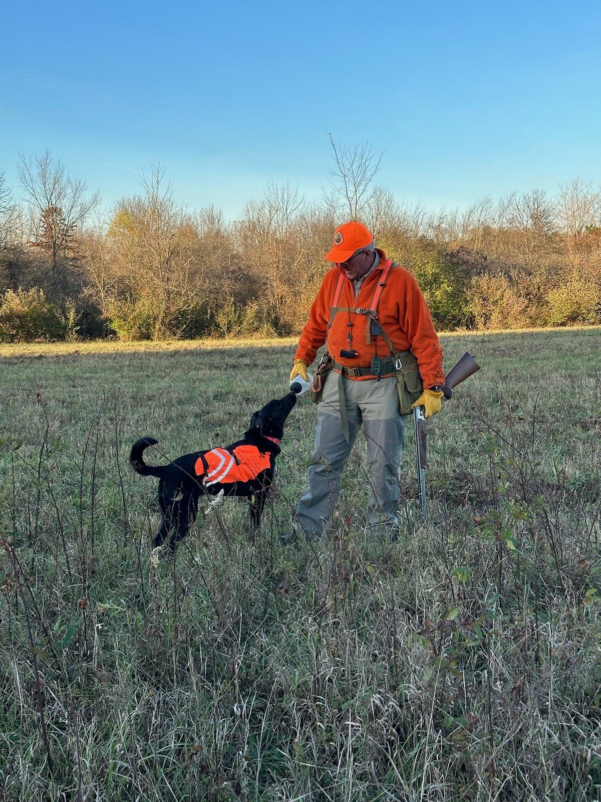 Hunter feeding his dog at Charlemont Reservation