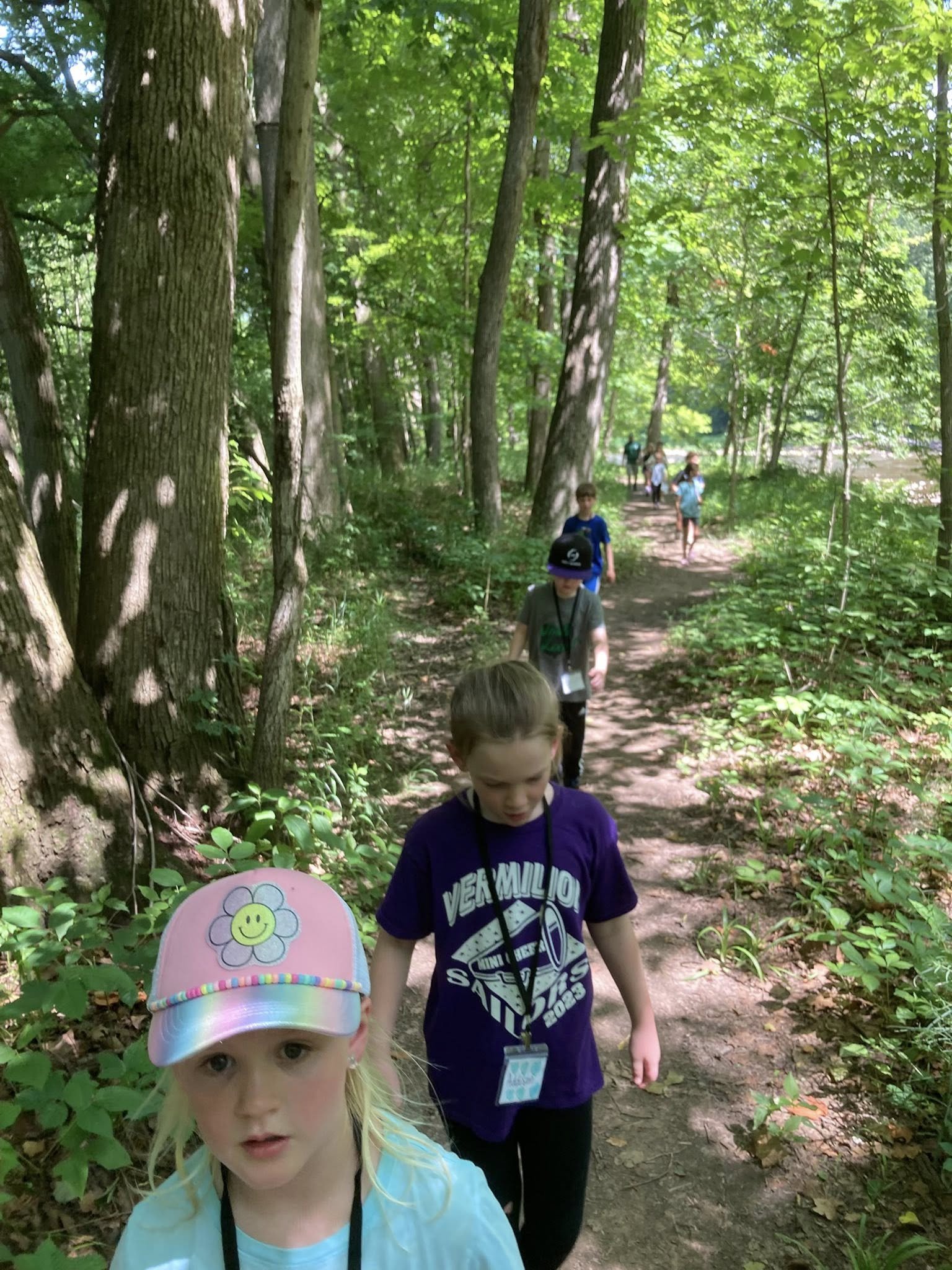 Campers exploring a wooded trail at Vermilion River Explorers Camp