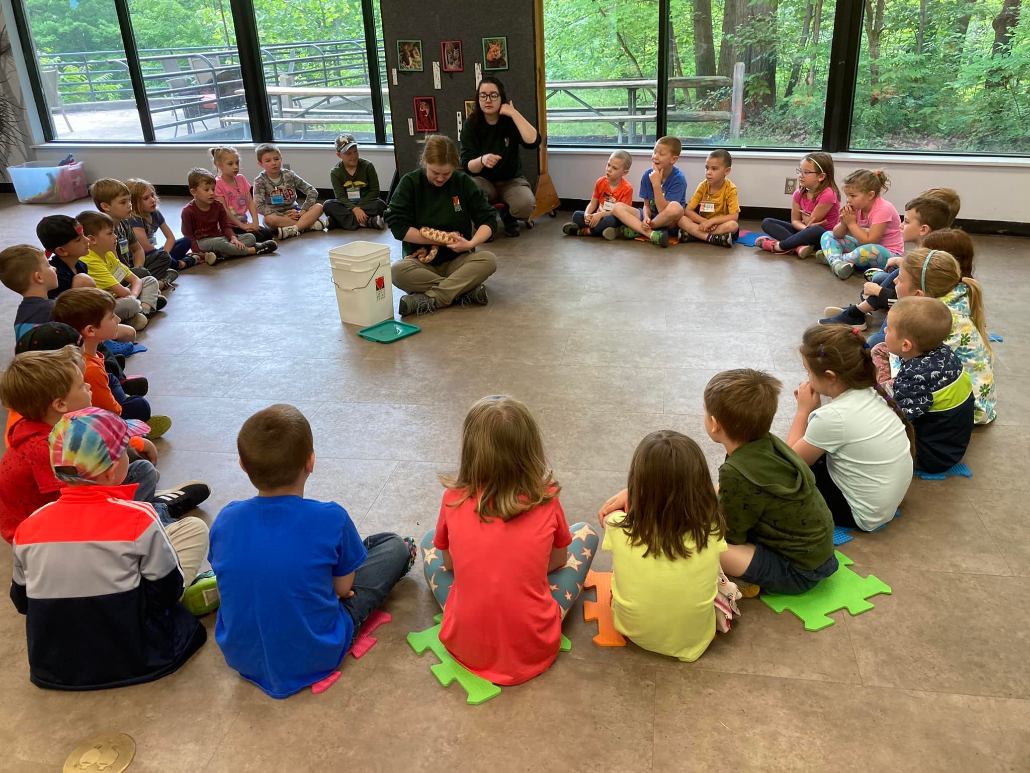 Campers experiencing a live animal demonstration at Summer Camp