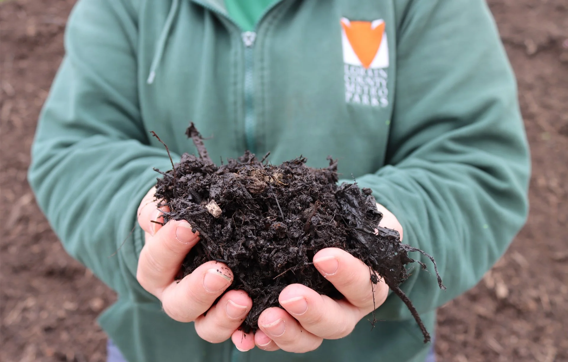 LCMP-staff-holding-dirt-1.jpg