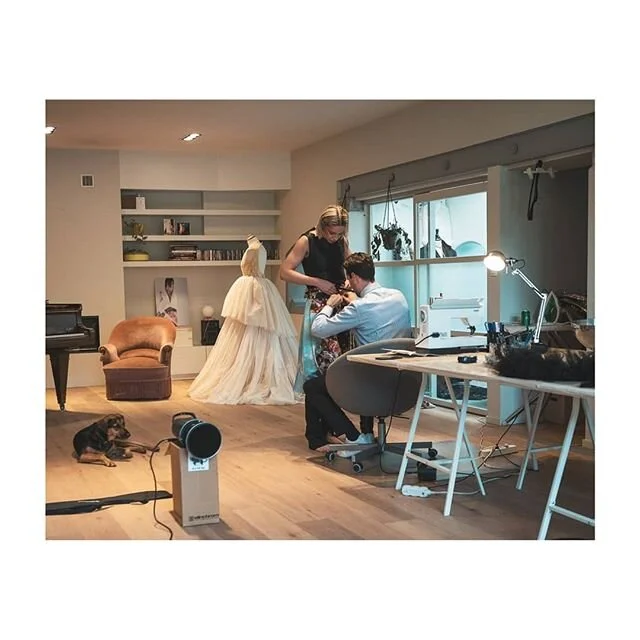 Welcome to Maison Bart Hoste ❤

Behind the scenes of our latest atelier shoot. We love dogs and piano's ☺. Yellow/gold tulle dress with a draped bodice and pearl embroideries on the side.

@asajerl trying on a pair of &quot;Fleurs du Mal&quot;  trous