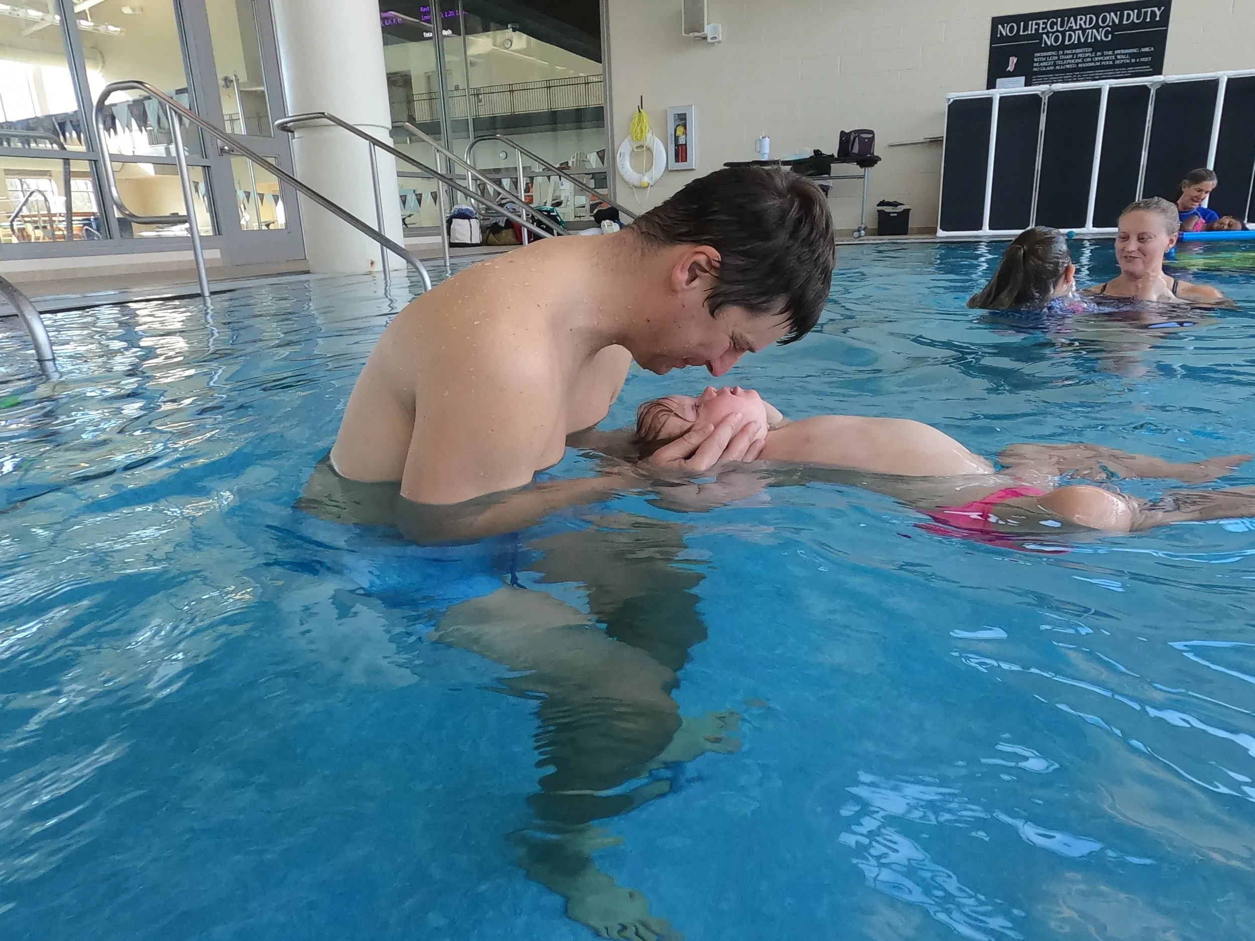 Solomiia and her dad floating.JPG