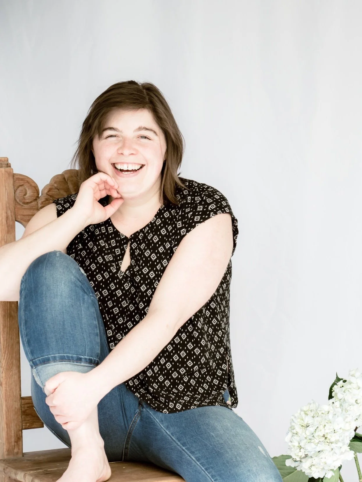 Jess Jackson, Licensed Massage Therapist, Somatic Experiencing Practitioner and Safe Sound Protocol facilitator, smiling, in Maine