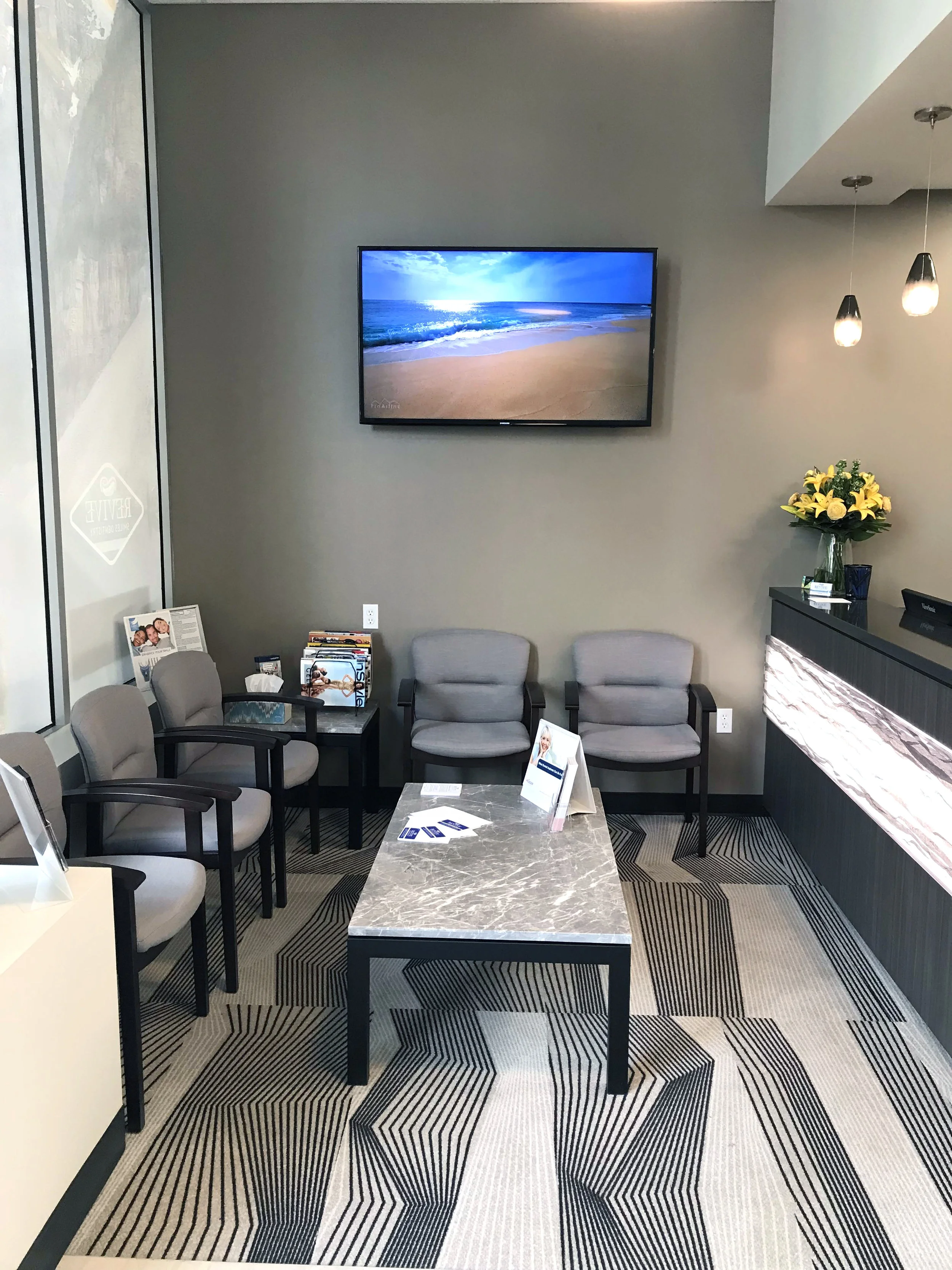 Modern, welcoming waiting area at Revive Smiles Dentistry in Seattle, Washington