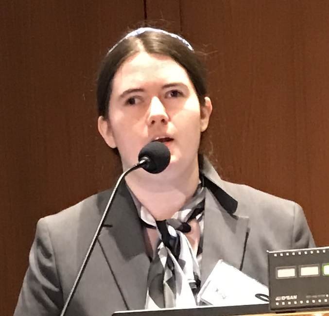 Ruti Regan giving a presentation