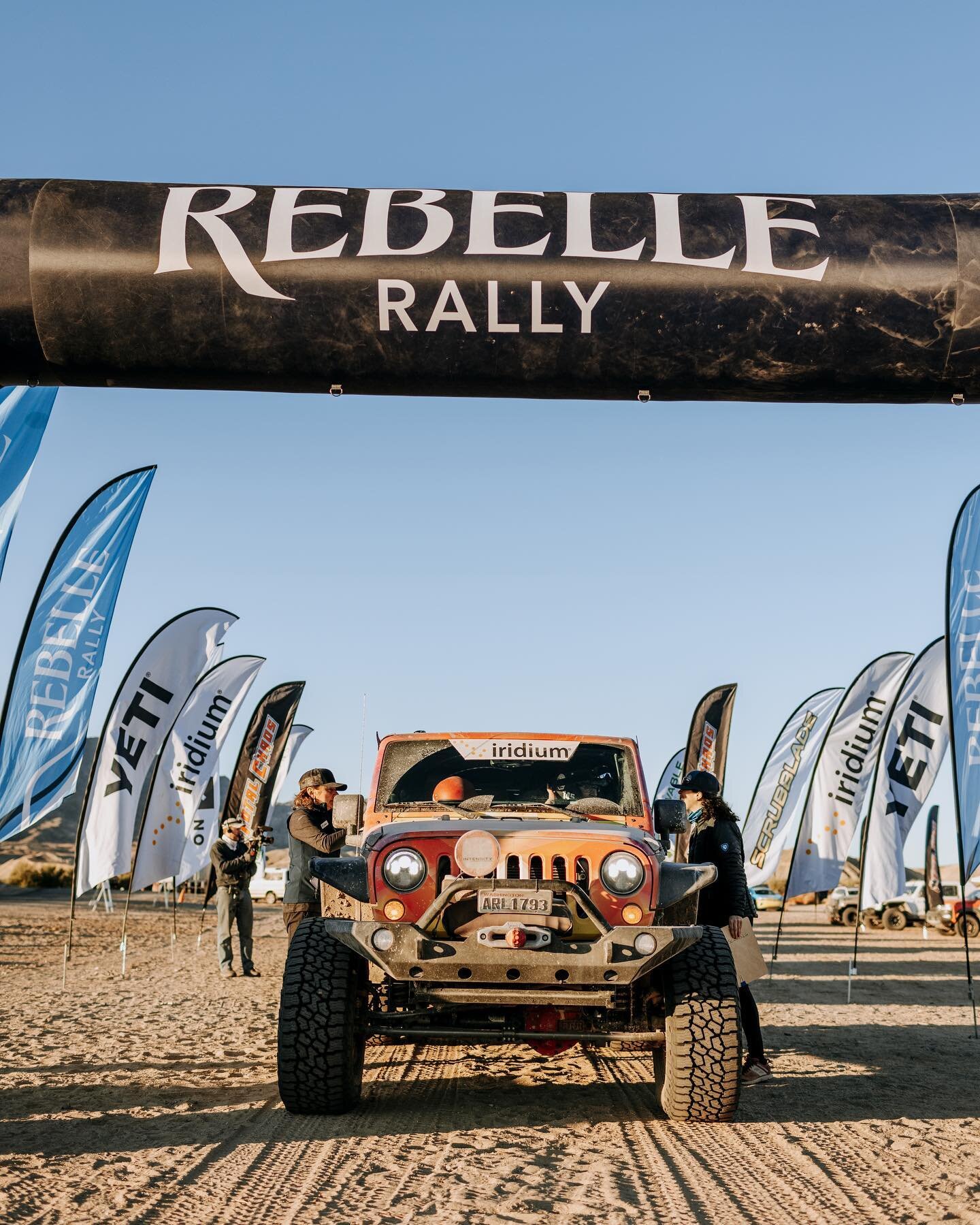 It is Front End Friday! Love this shot of Bob under the @rebellerally start/finish line! @icdcoatings @wagantech #teamwork #bestteam  #bestfriends #teammates⁠ #outdoorgirls #outdoorwoman #womenwhoadventure #adventuregirl #beyondthesummit⁠ 
#offroad #