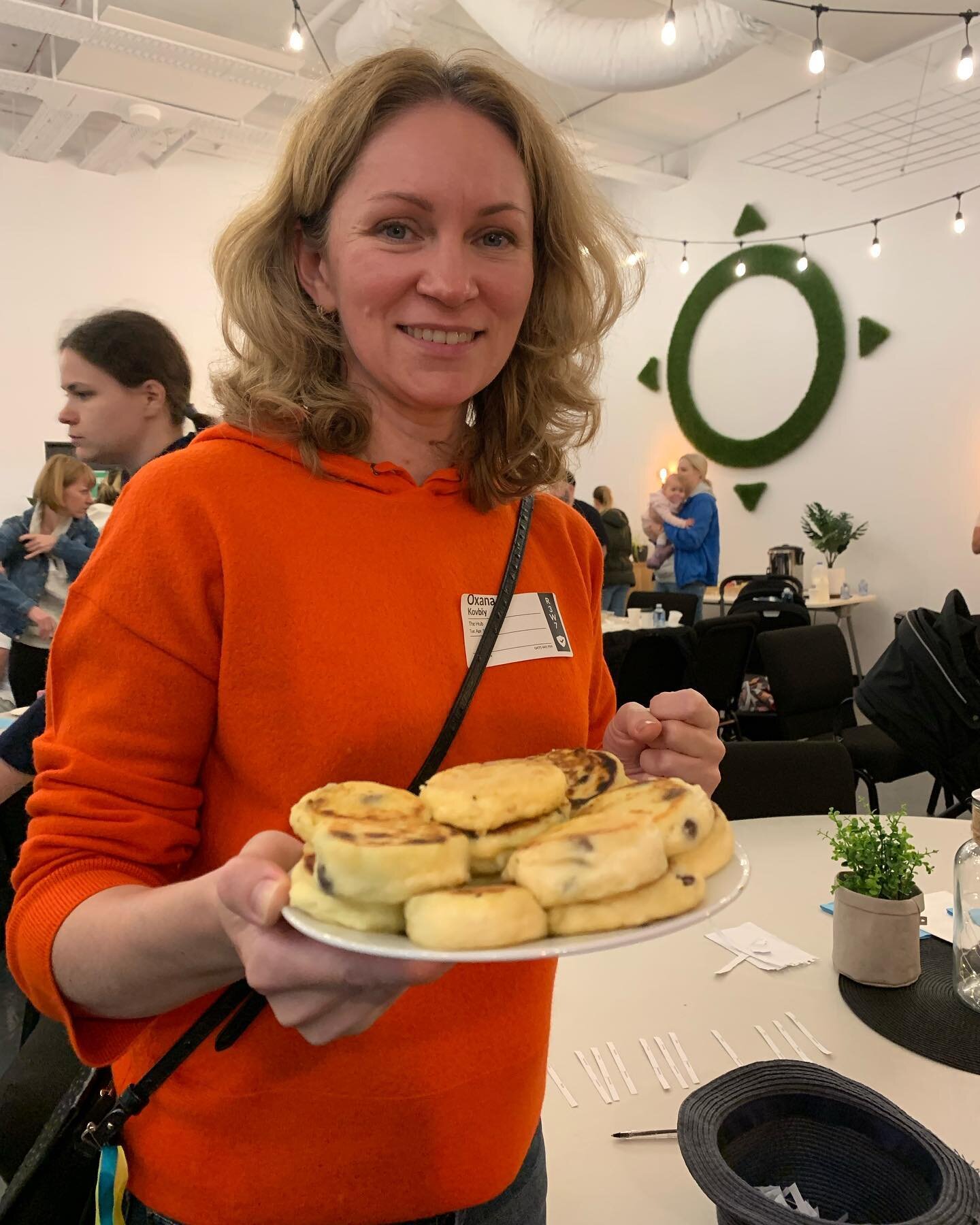 Thank- you to our beautiful volunteer Oxana holding a delicious plate of Ukrainian cottage cheese pancakes at our first Family Fun Night for Ukrainian refugees on April 12th. We look forward to hosting Family Fun Nights every fortnight with Evolve He