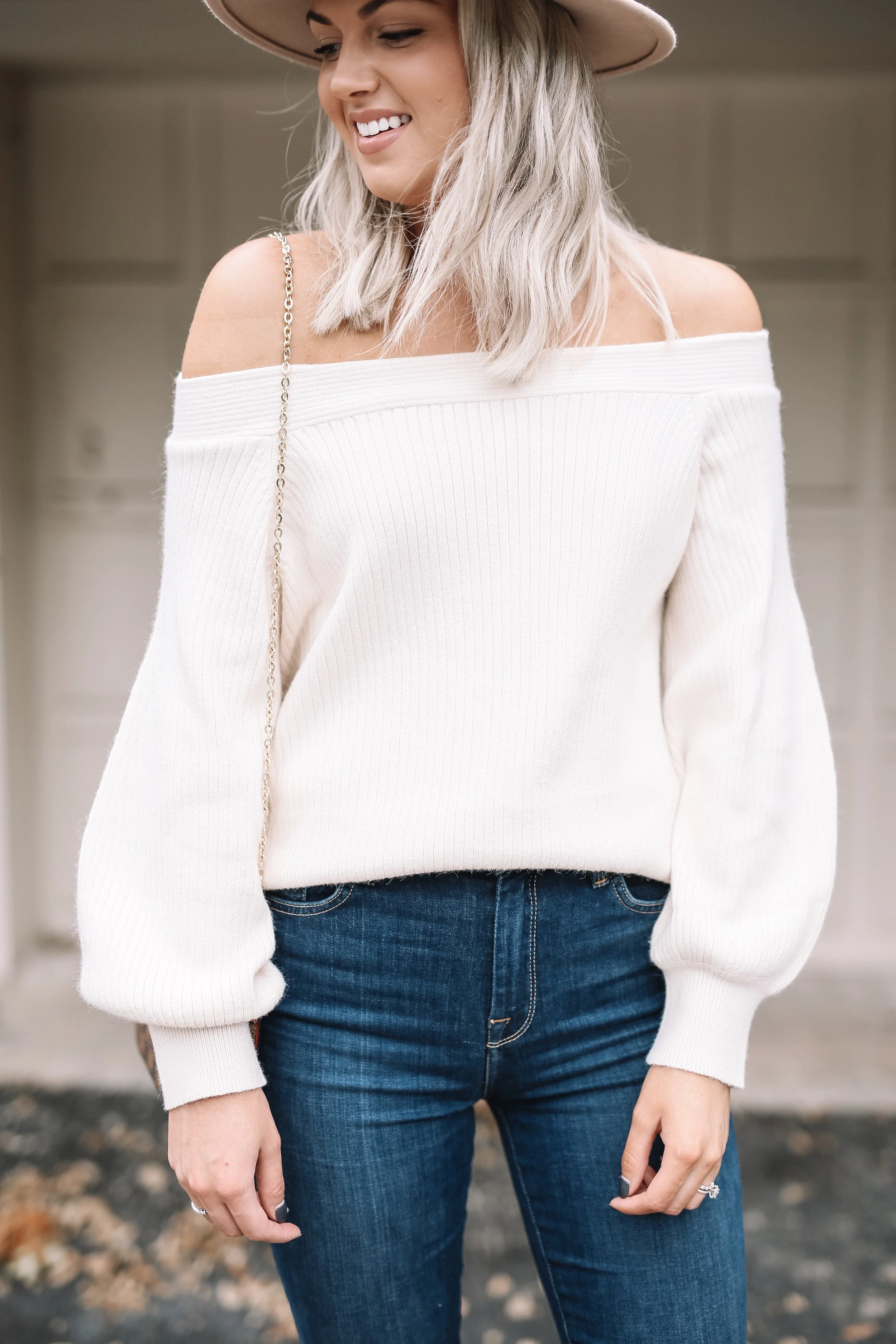 This sweater can be worn off the shoulder or on! Love the puff sleeve detail.