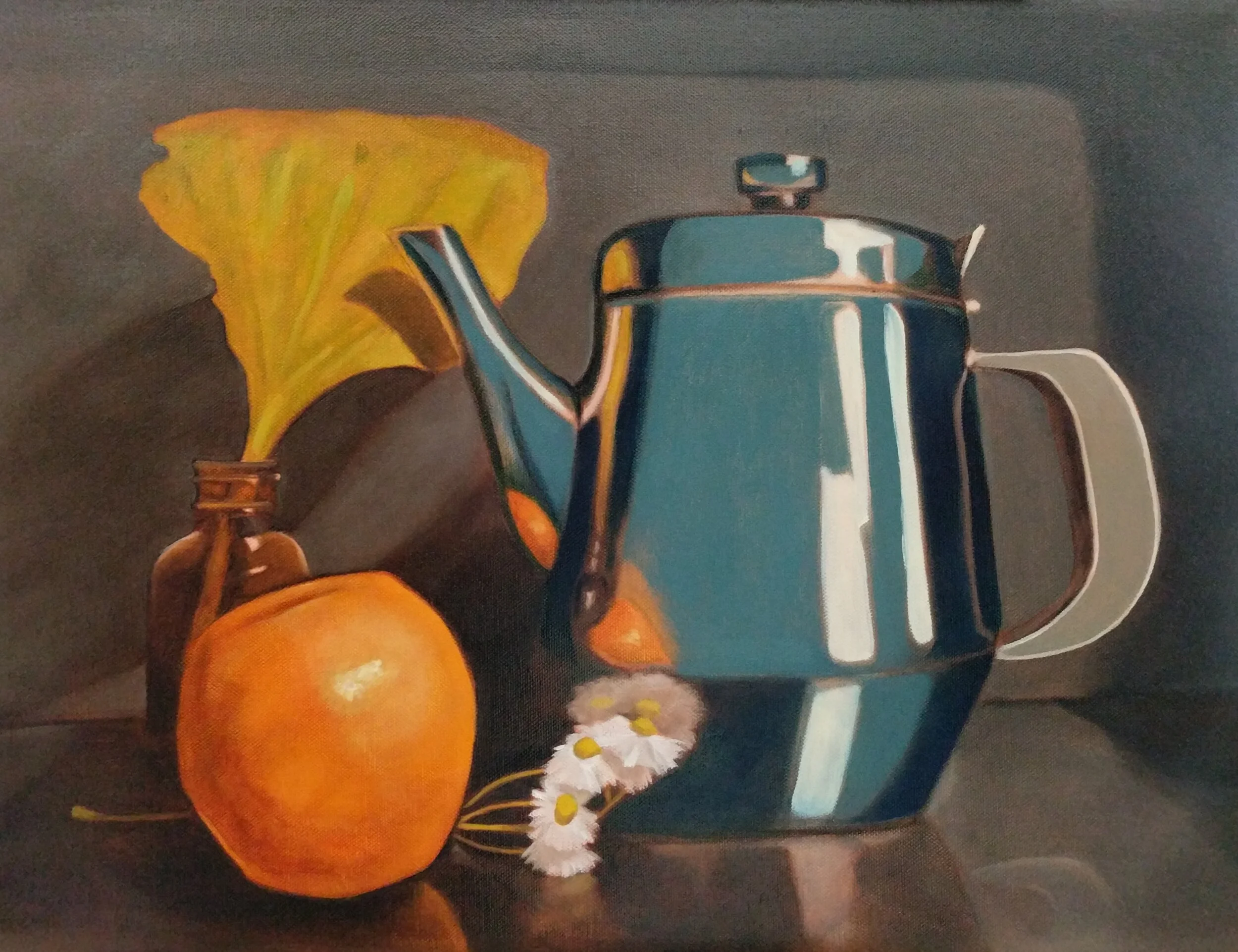 Still life of a small brown glass jar with a yellow leaf, an orange fruit, white flowers with yellow centers, and a vintage-style metallic teapot on a dark surface.