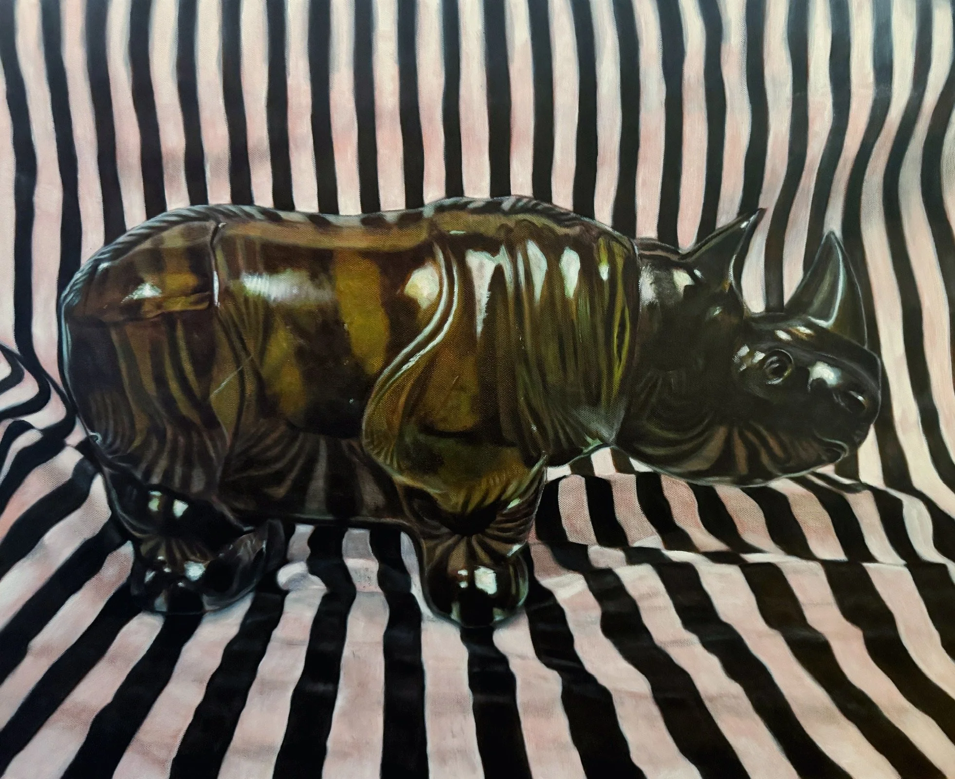 A painting of a green glass sculpture of a rhinoceros , placed on a black and white striped fabric background.