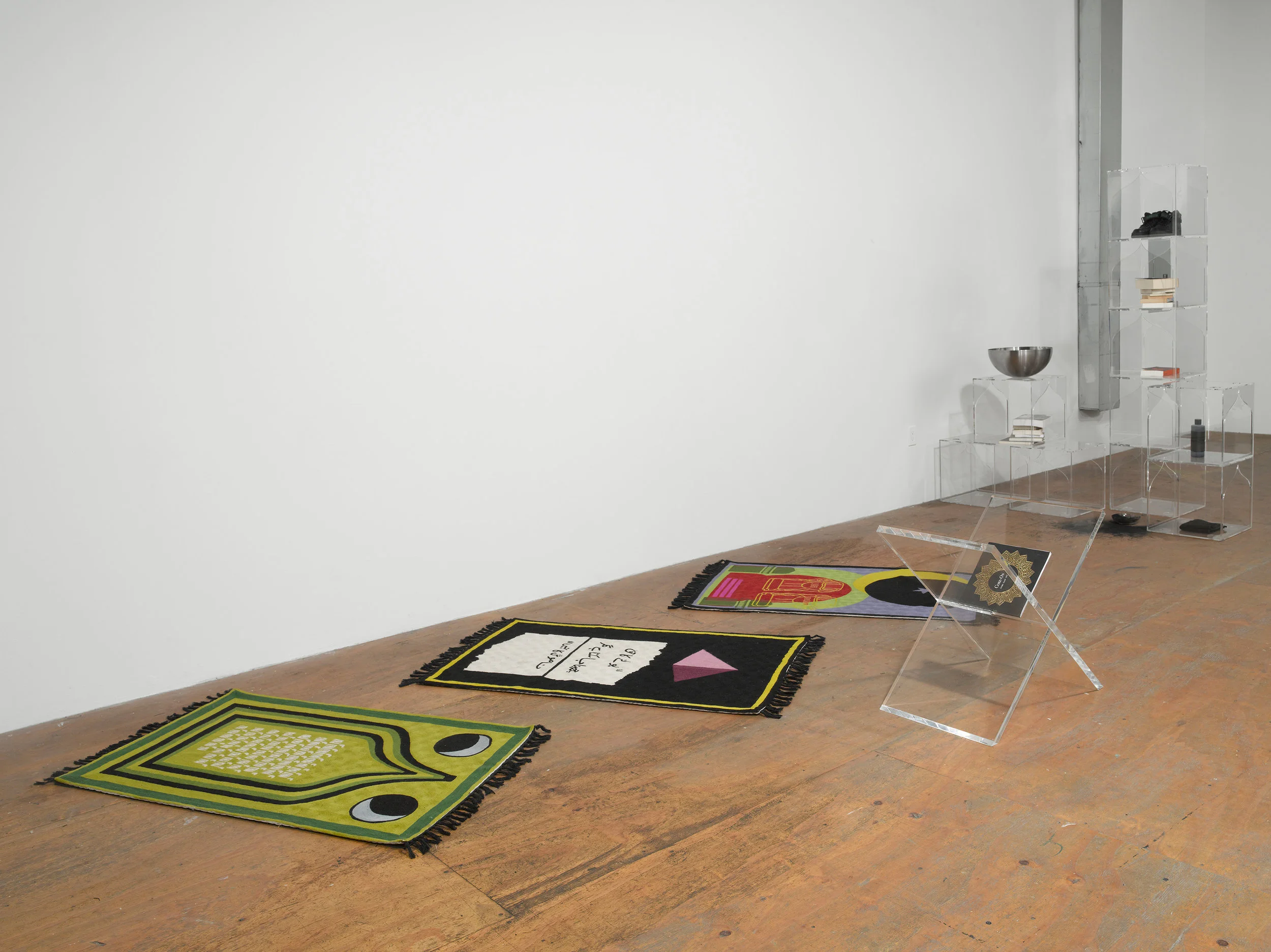 (From left to right) Lunar Count Down, Act Up, Purple Heart, Participant INC., NY, Handmade wool rugs custom designed by artist, made in Kashmir, 48 × 30 in, 2017