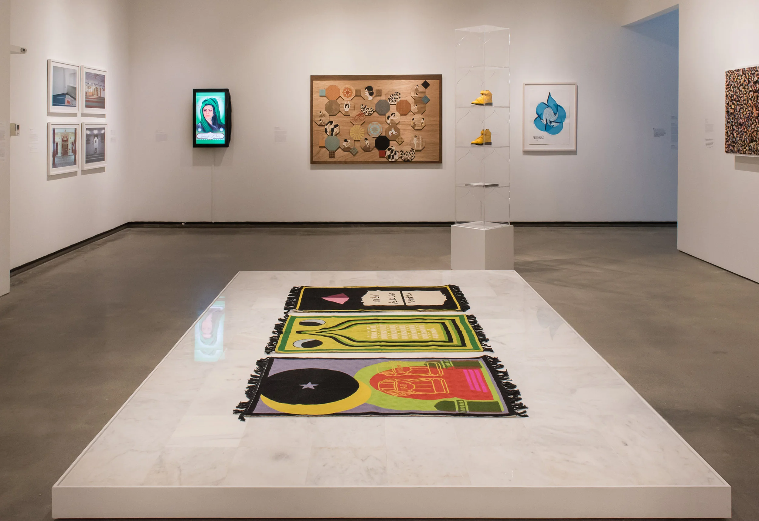 (From left to right) Purple Heart, Lunar Count Down, Act Up, at Katonah Museum of Art, NY,Handmade wool rugs custom designed by artist, made in Kashmir, 48 × 30 in, installed on marble platform, 2018