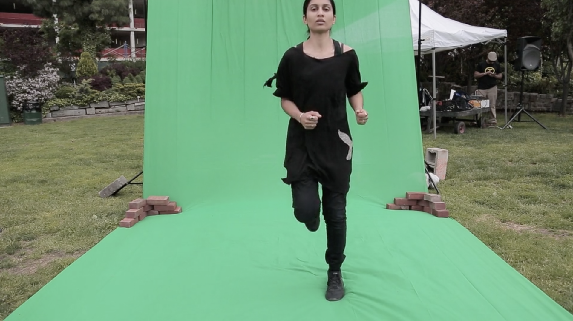 Planet Fitness, 2016 Running before a blank green screen in a NYC public park, set to a custom soundtrack mix I often use to run as a form of meditation. The soundtrack includes Sufi musician Nustrat Fateh Ali Khan, Belgium pop star Robyn, and renowned Indian vocalist Lata Mangeshkar. My ritual of resilience speaks to experiences of displacement within the United States, and more prominently in Europe. Project me where every you wish, there is a green screen provided for your leisure. 20 minute running performance set to a custom soundtrack.