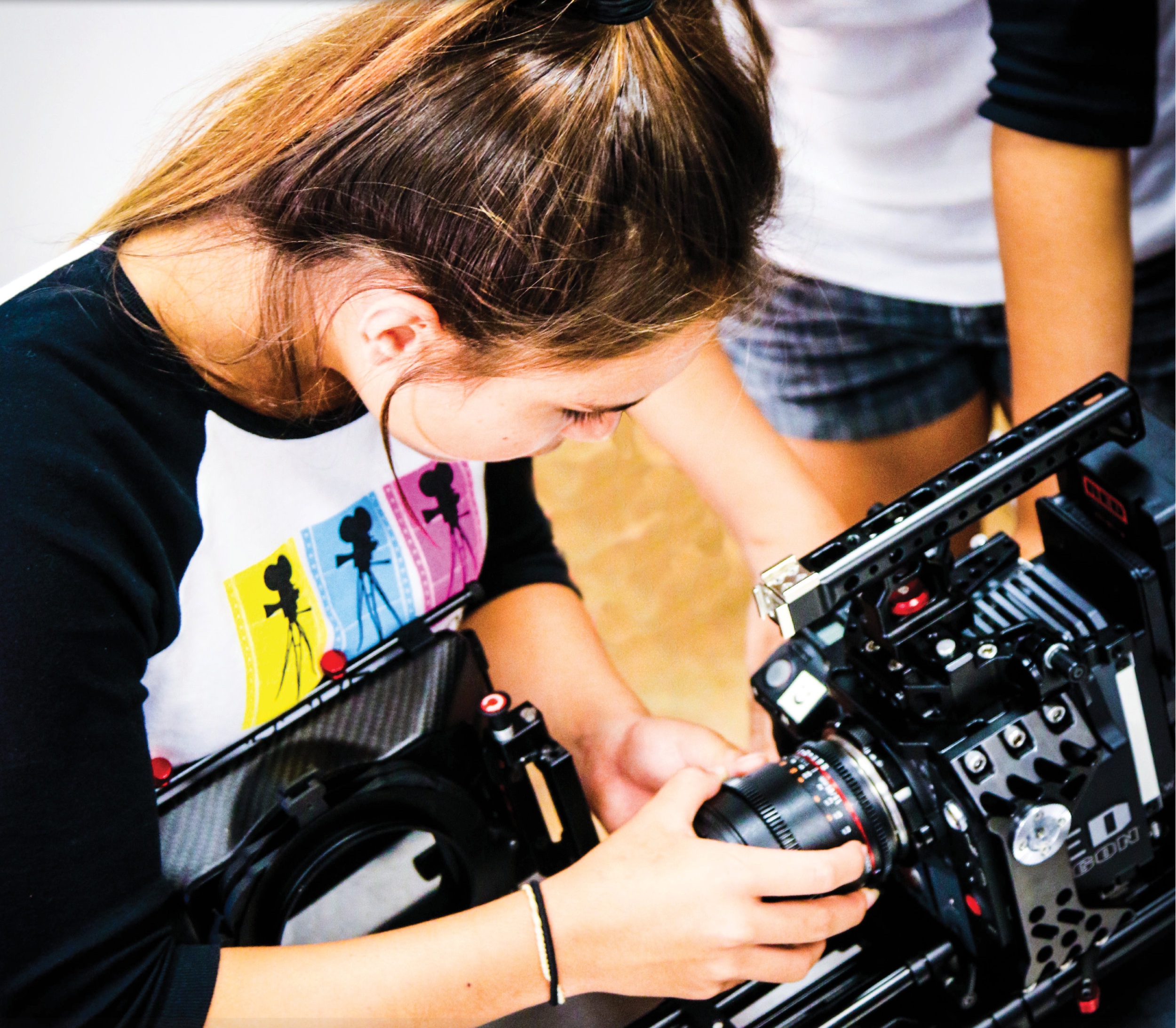  Kahea learns first hand how to change out a lens on a Red Cinema Camera on location at our summer advanced training class. 