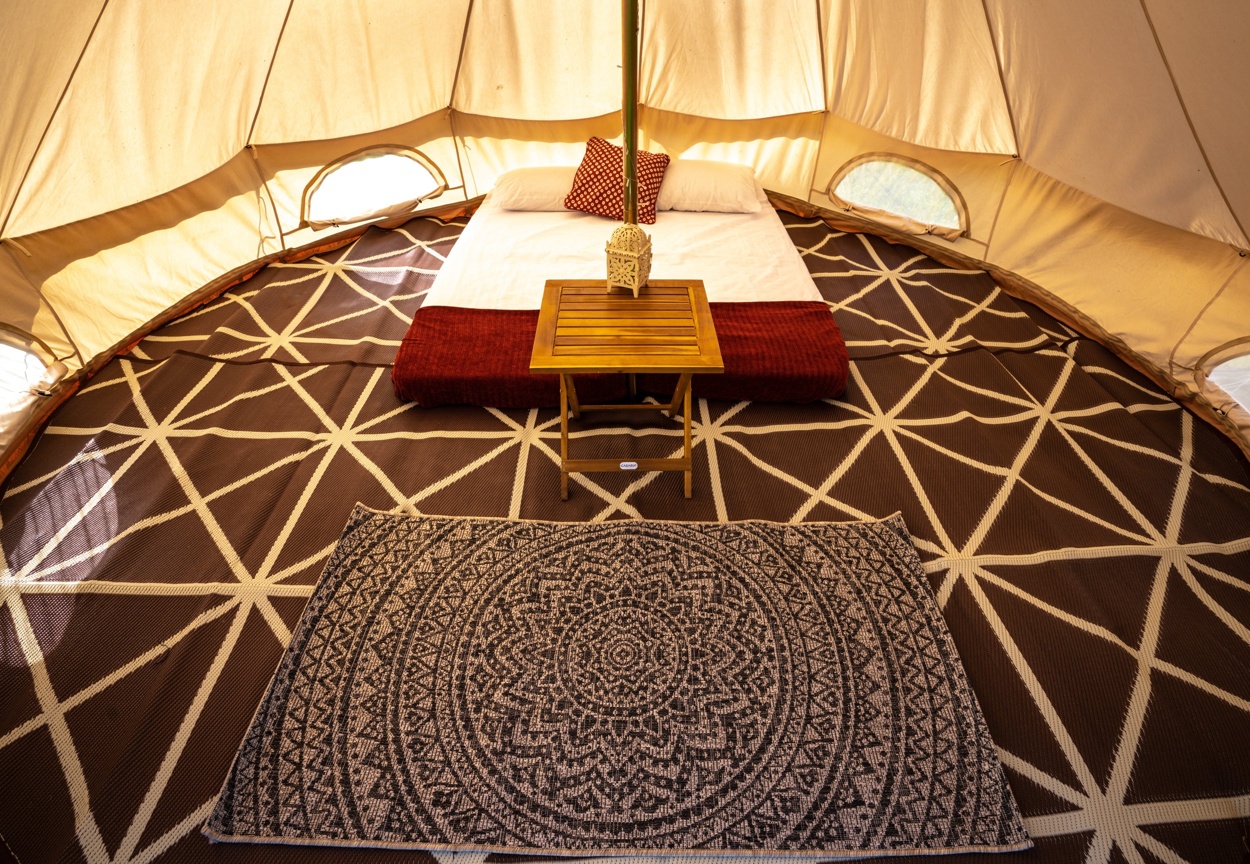 Classic bell tent inside with bedding.jpeg
