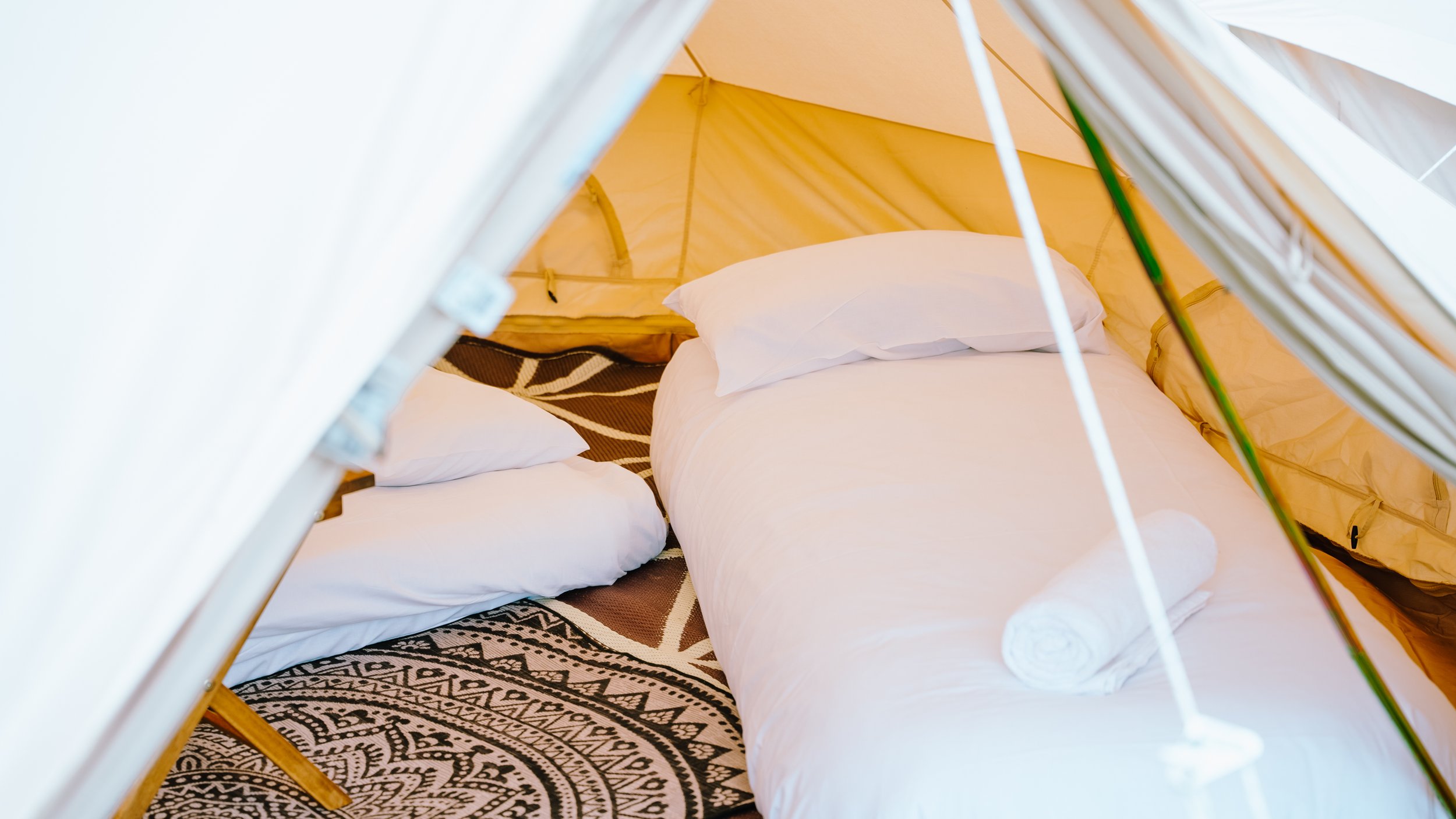 Classic bell tent with airbeds and bedding at big love festival