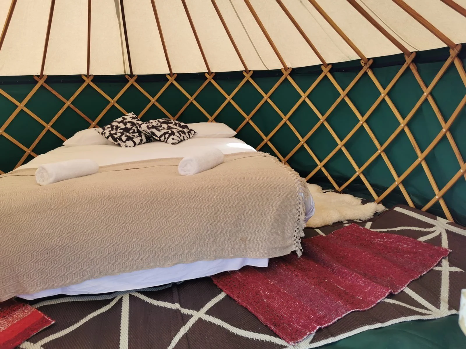 Luxury yurt accommodation in green at lindisfarne festival