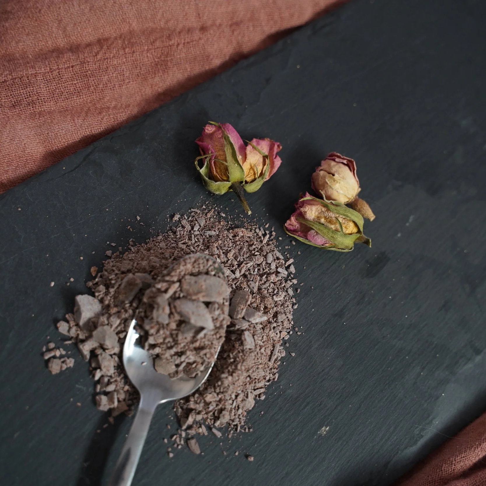 Cacao crumbles on a spoon ready for use
