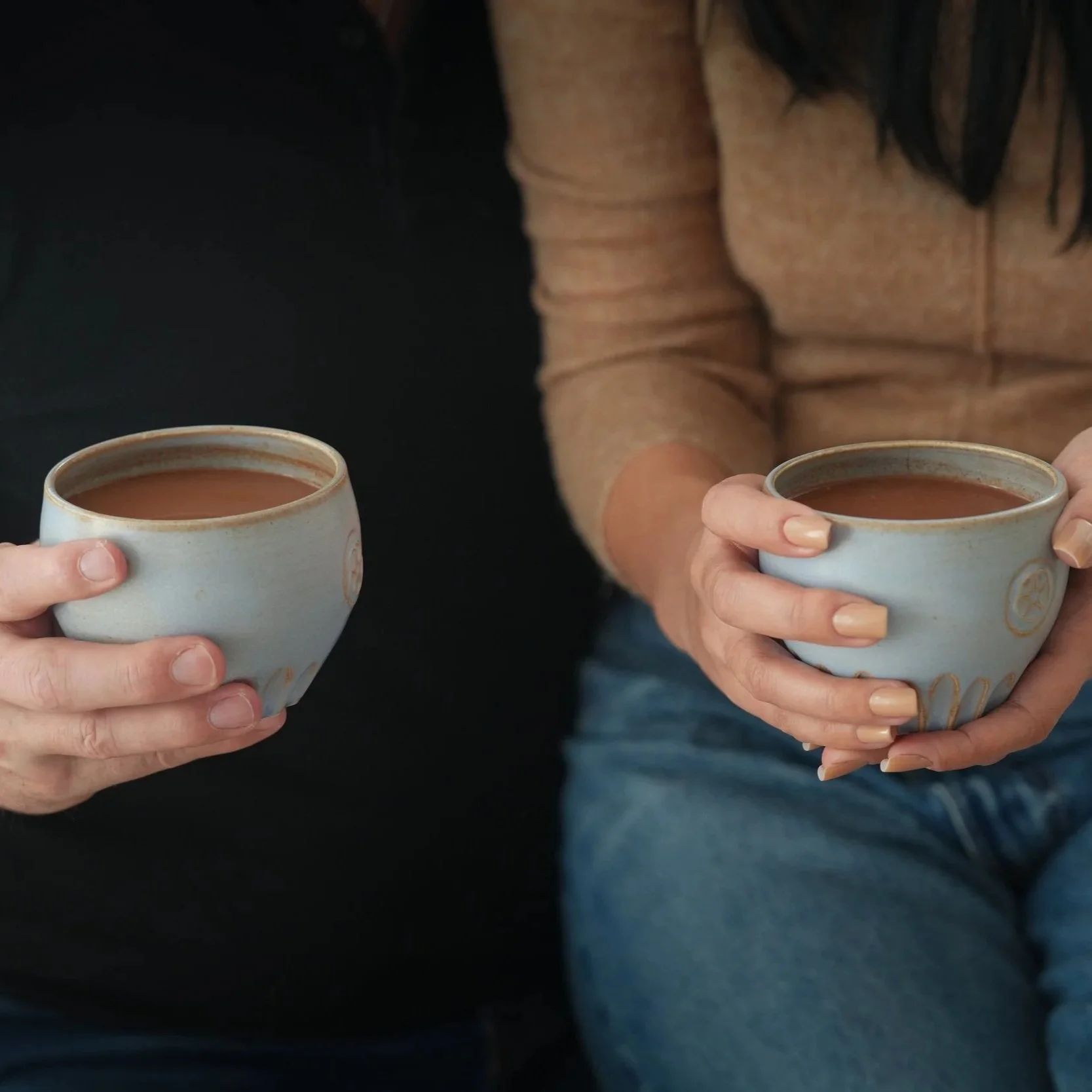People drinking hot cacao from a daily dose for 2 pod