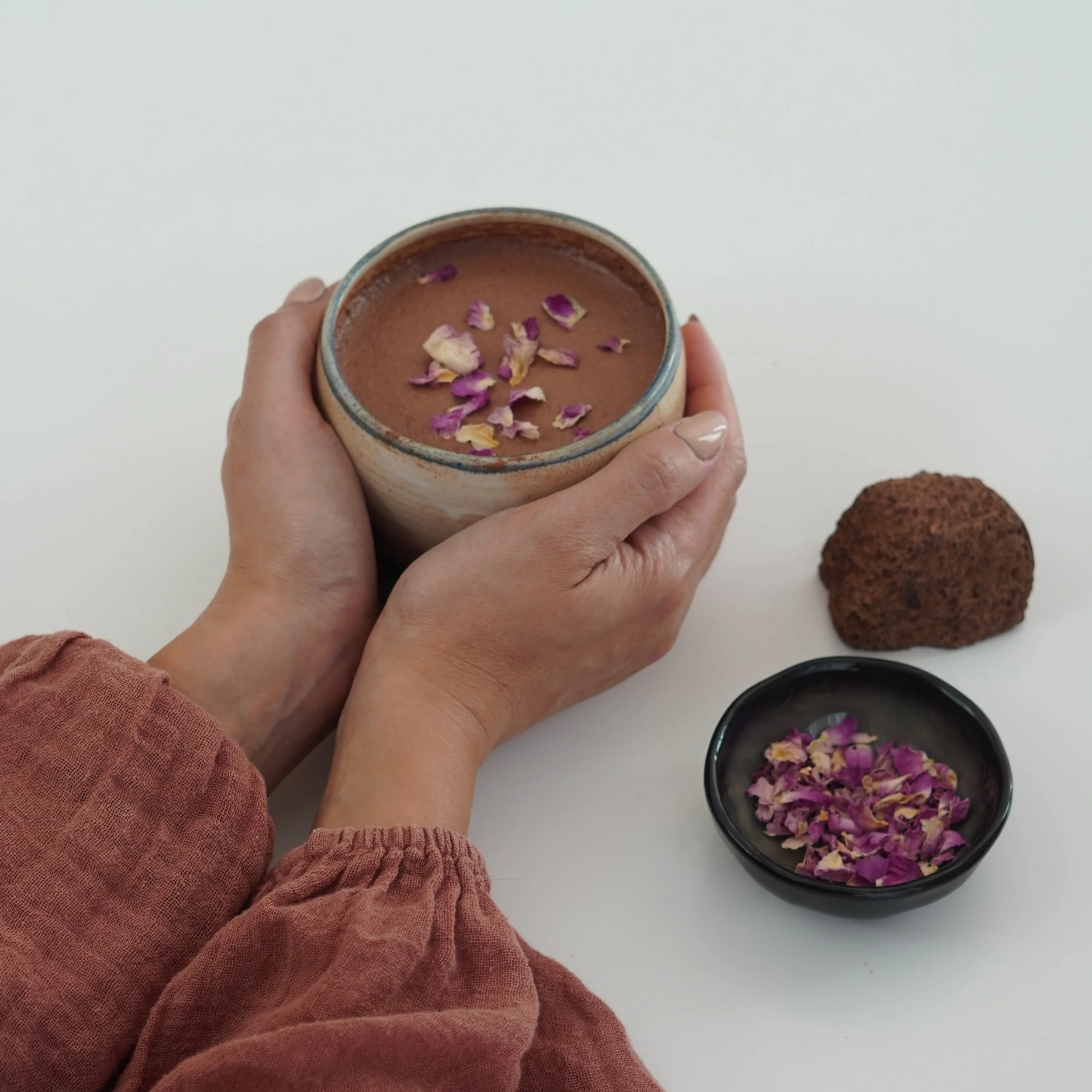 Woman holding hot cacao using daily dose pods
