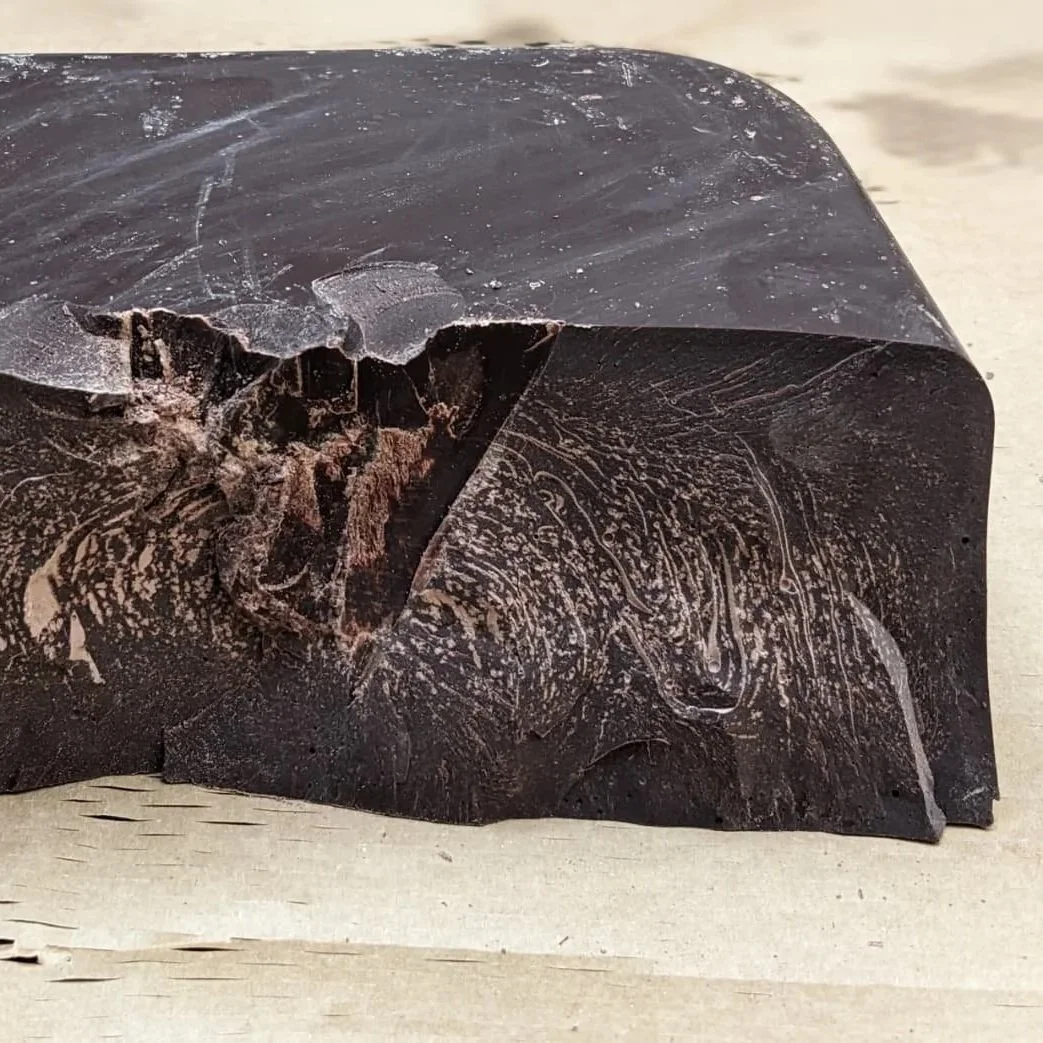 Close up of ceremonial grade cacao block surface texture