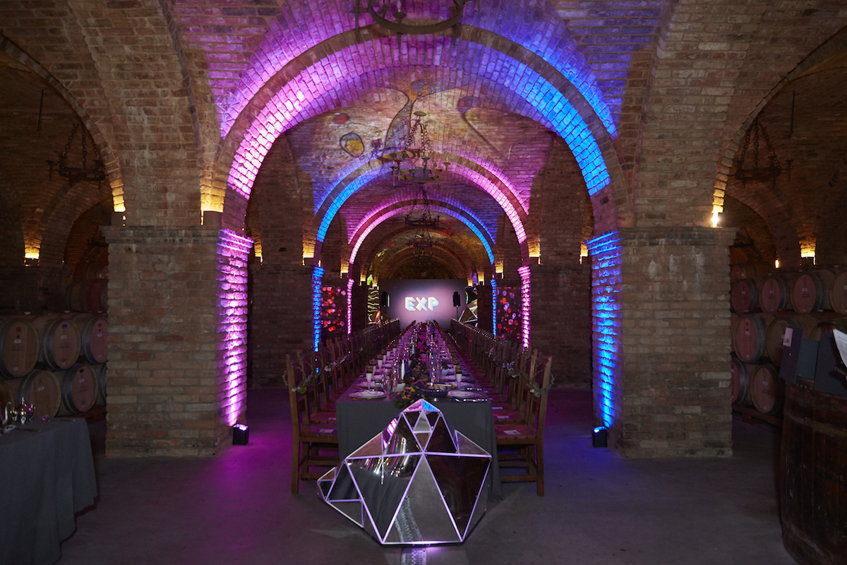 After walking down about six feet underground, guests entered the Grand Barrel Room, designed by Next Art .