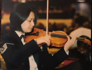 Jessica performing as a part of the Air Force Strings for Chinese President Jiang Zemin's visit