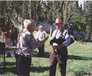 Mo. Fricke "conducting" Steve Bates on bagpipes