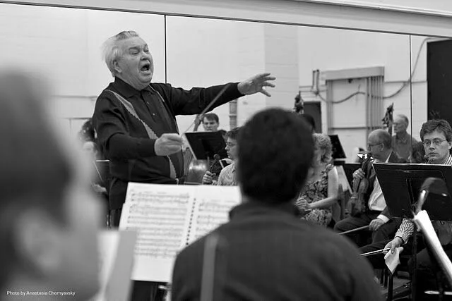 Maestro Fricke rehearses the orchestra and singers. Photo Credit: Anastasia Chernyavsky
