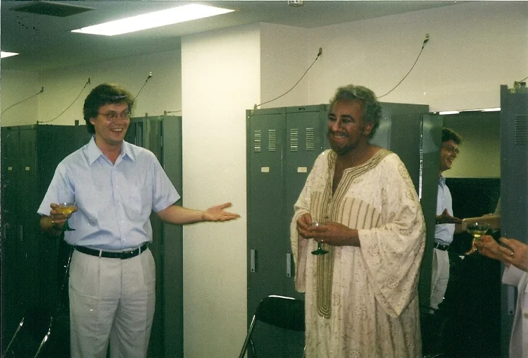 Concertmaster Oleg Rylatko toasting Domingo after a performance of Otello