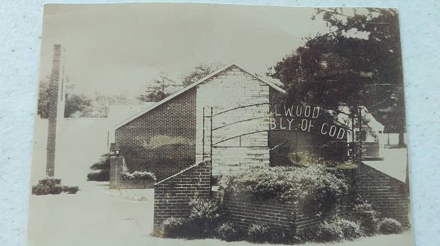 An outside picture of the original sanctuary and church sign. The only one we can find is in black and white.