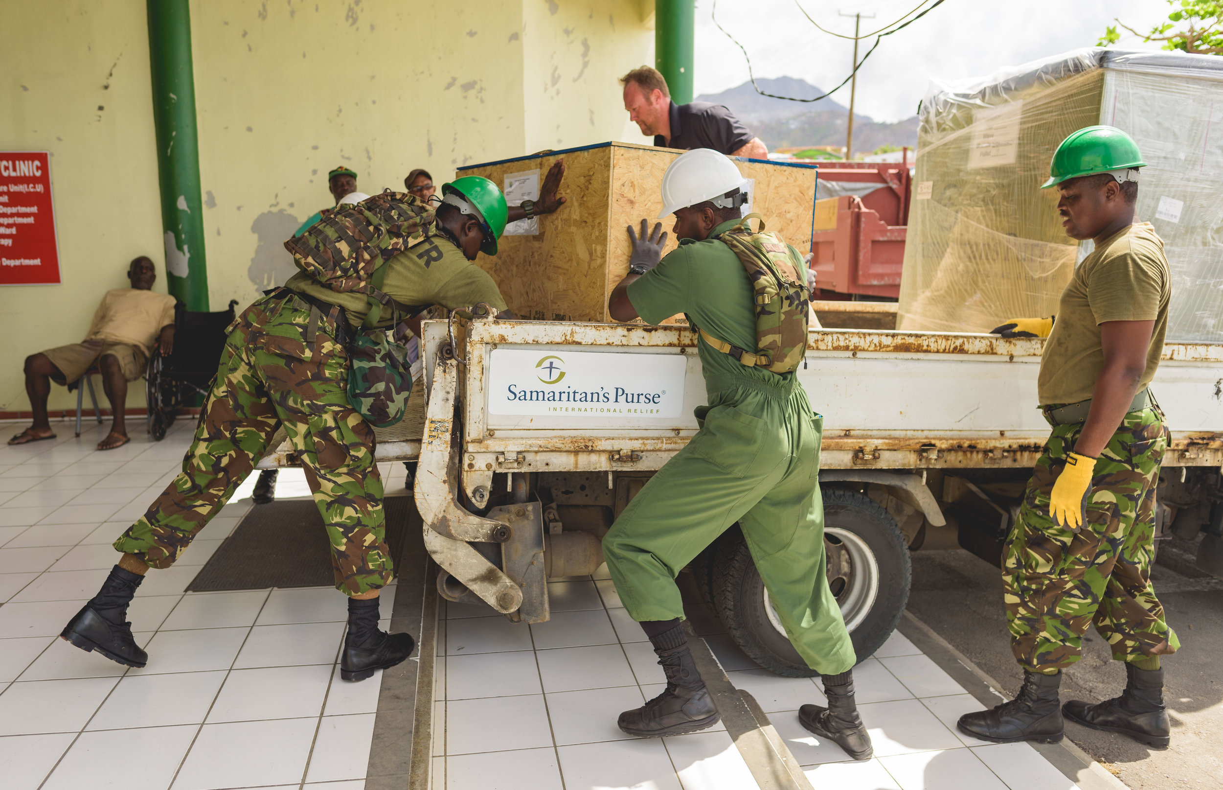 Roseau, Dominica - Military personnel unload water purification systems for the island.
