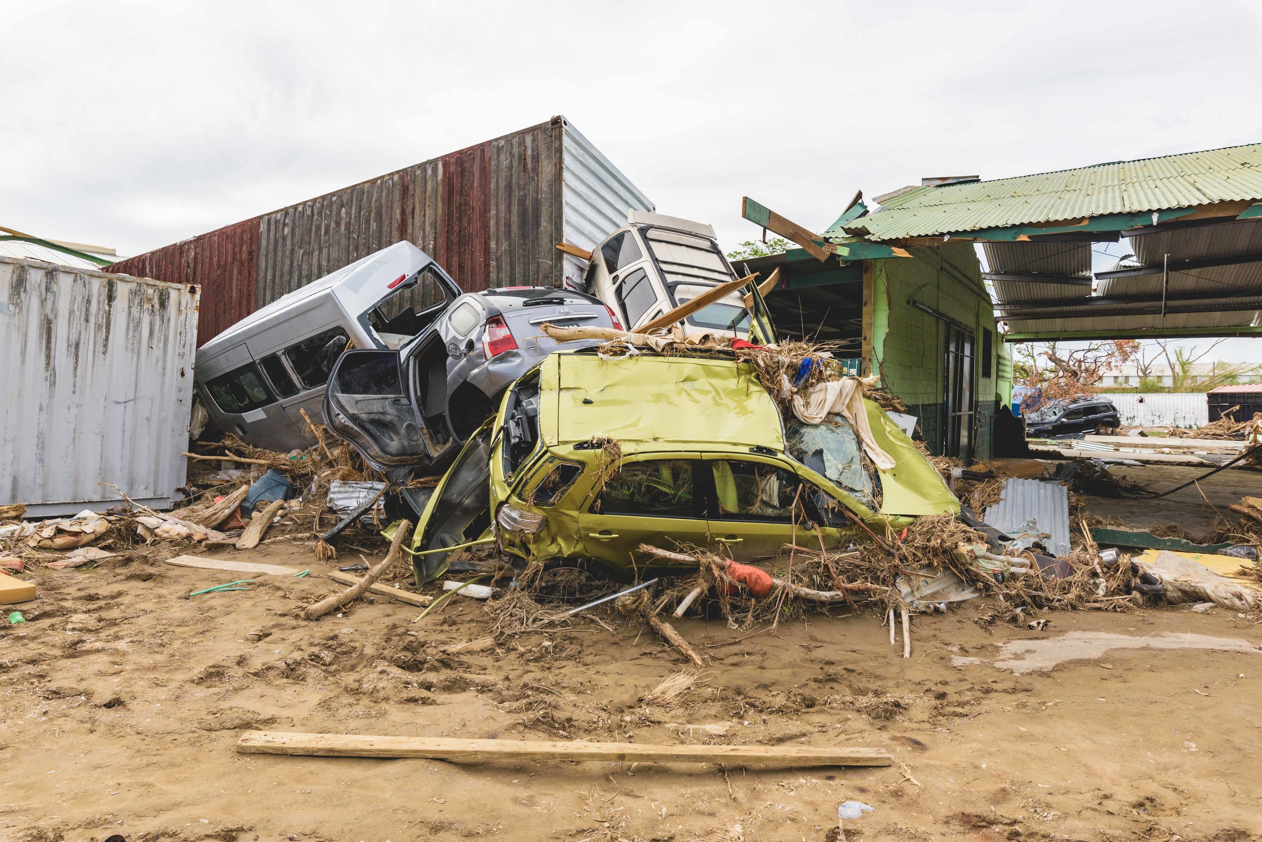 Roseau, Dominica - Piles of mangled automobiles and other debris lie in the wake of the destruction caused by Hurricane Maria.